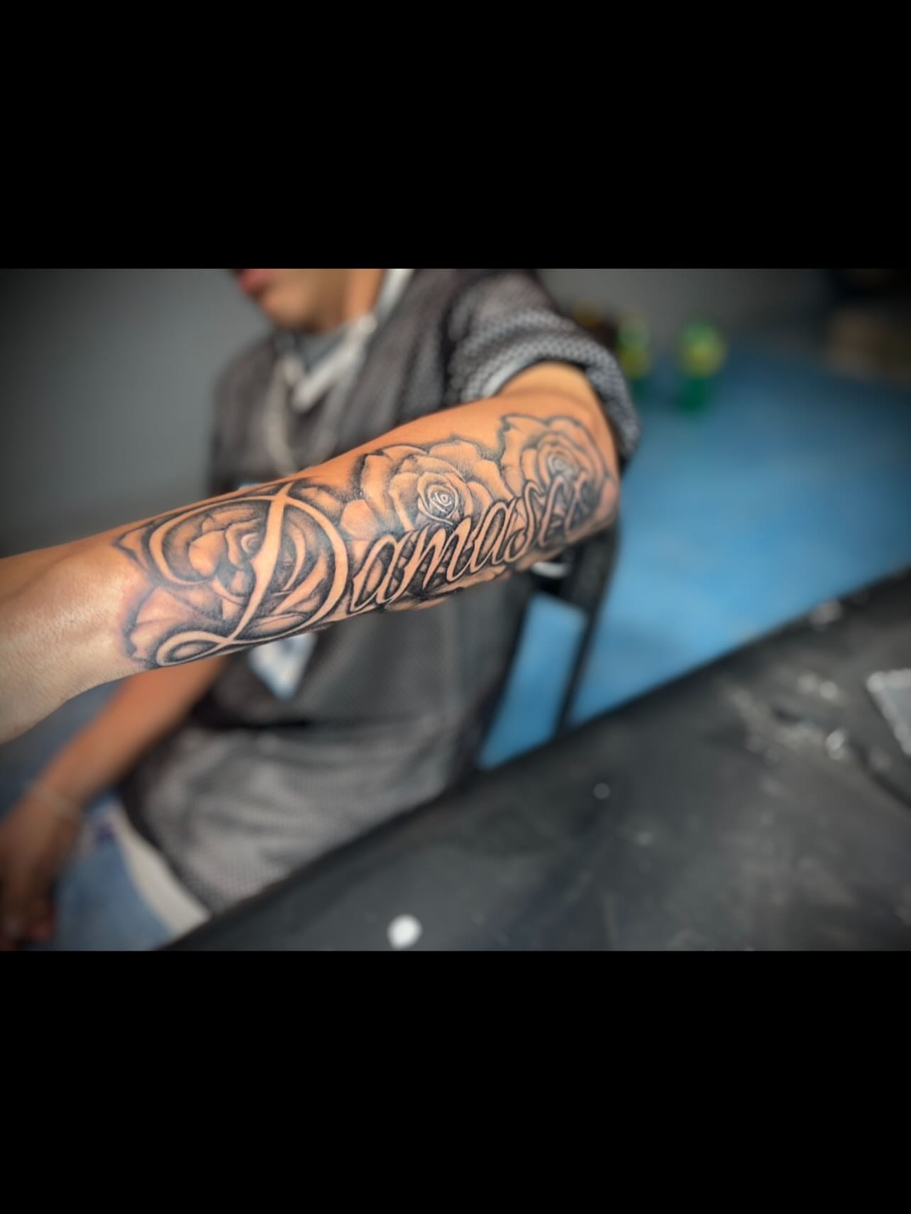 Roses black and grey tattoo on the forearm by Tu SanchoTattoos