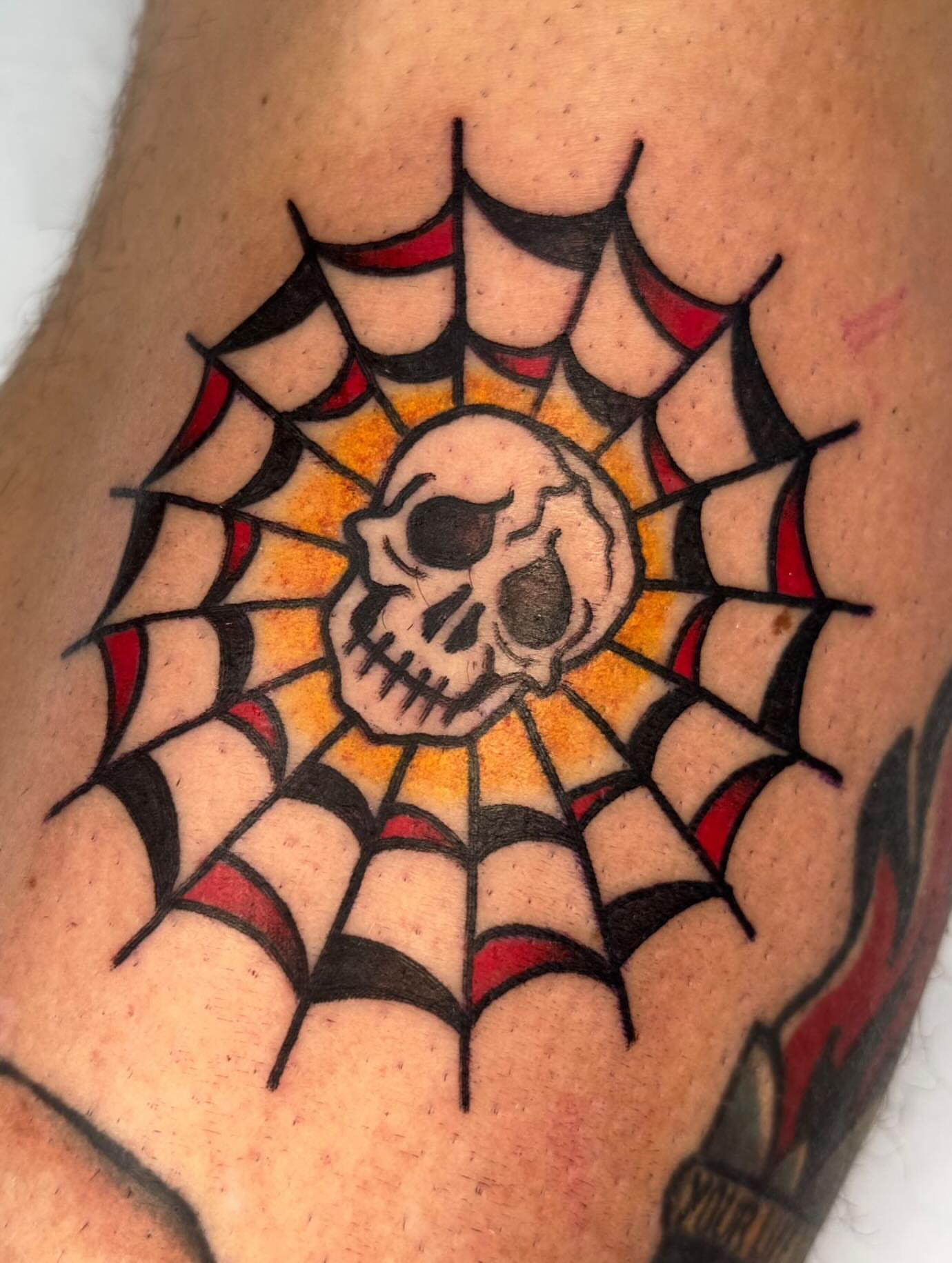 Spiderweb with skull American traditional tattoo on the forearm by Marta La Jirafa