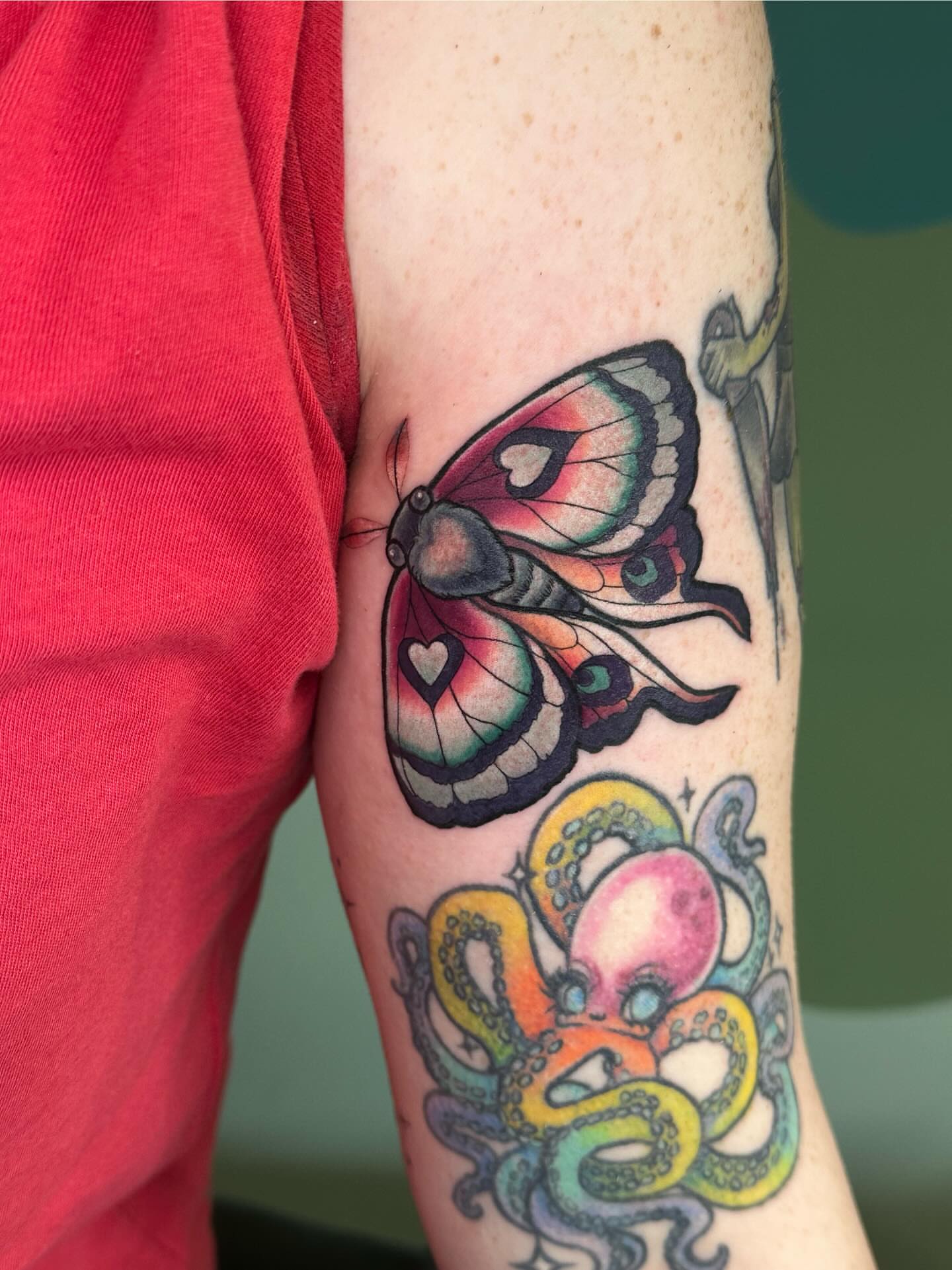 Butterfly and octopus new school tattoo on the forearm by Katie Hutchins, Dayton, Ohio