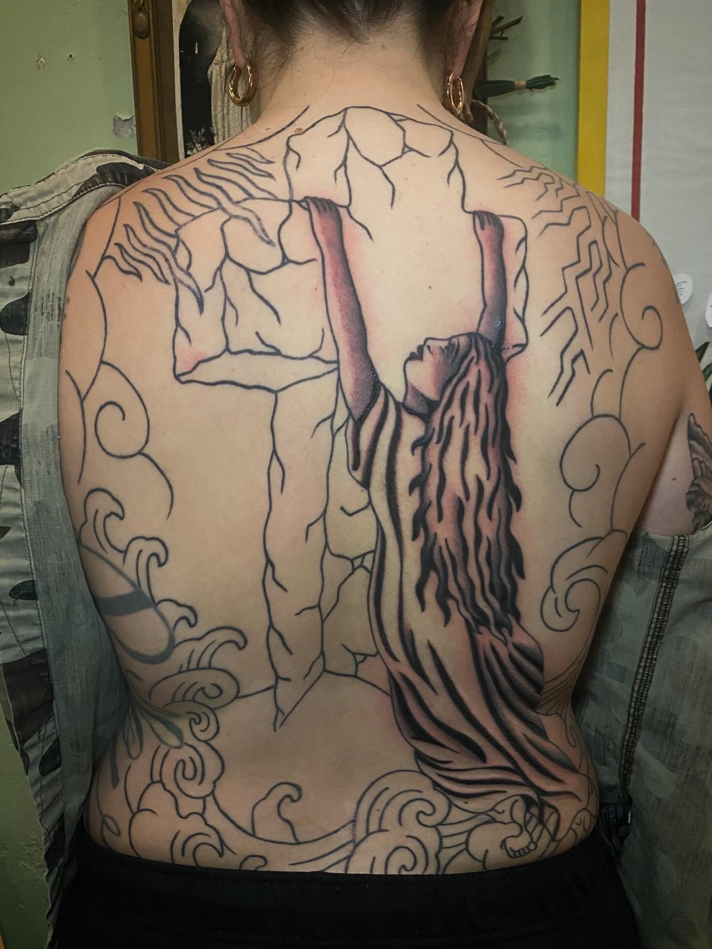 Woman reaching upwards black and grey tattoo on the back by Jaclin Grace Hastings