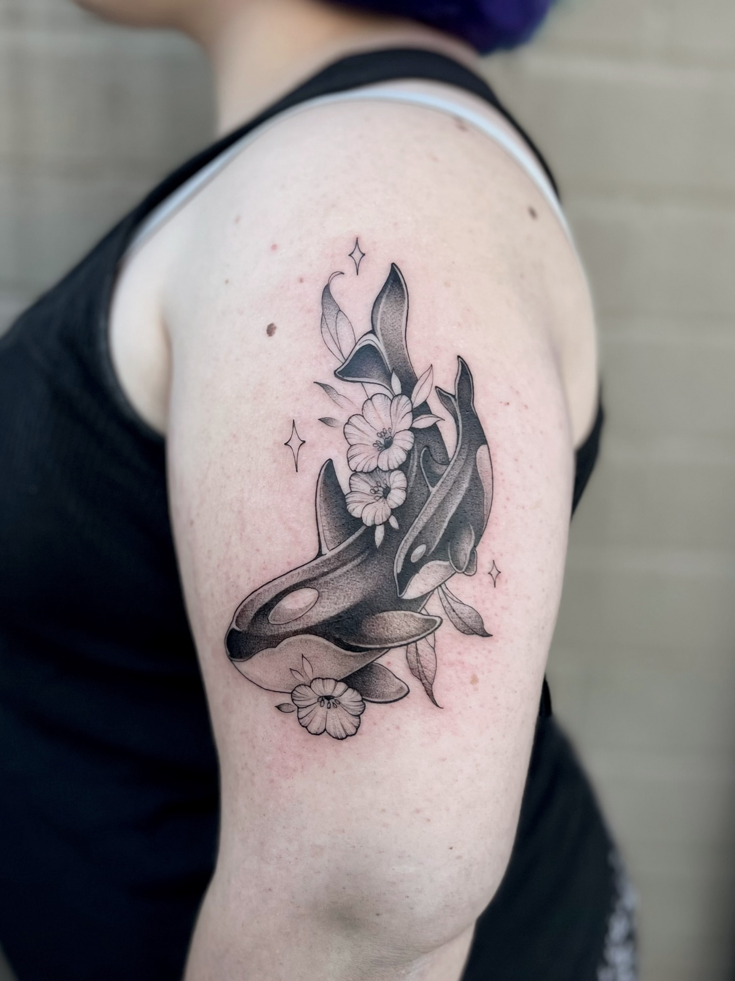 Whale and flowers black and grey tattoo on the shoulder by Tehnaya