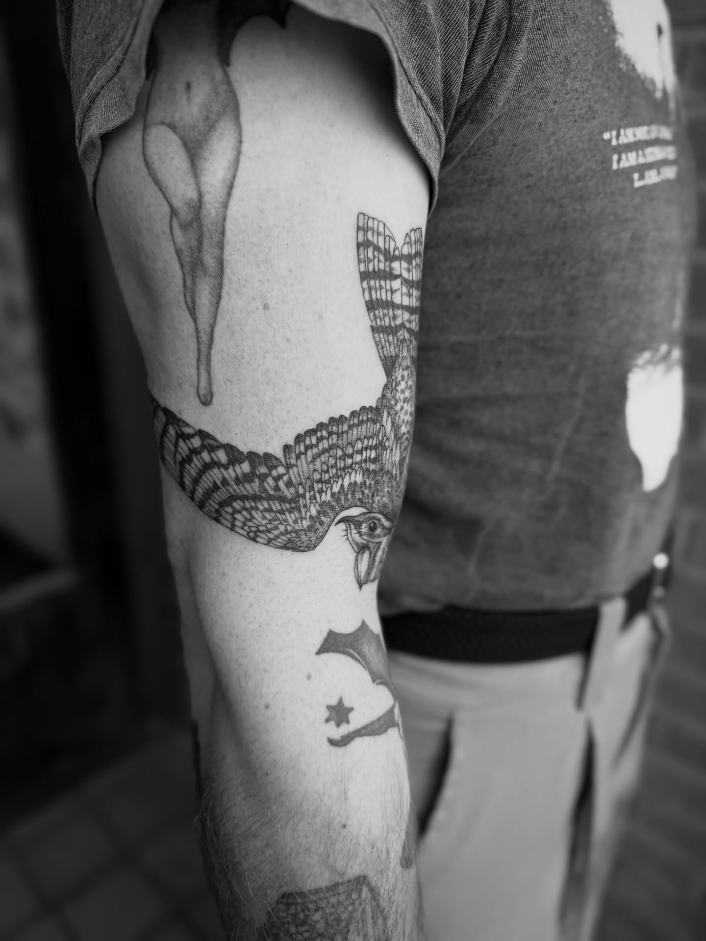Bird black and grey tattoo on the forearm by Alex Brooke
