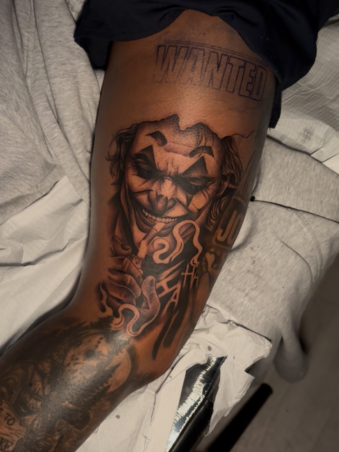 Joker realism tattoo on the thigh by Savannah Tattoo Artist