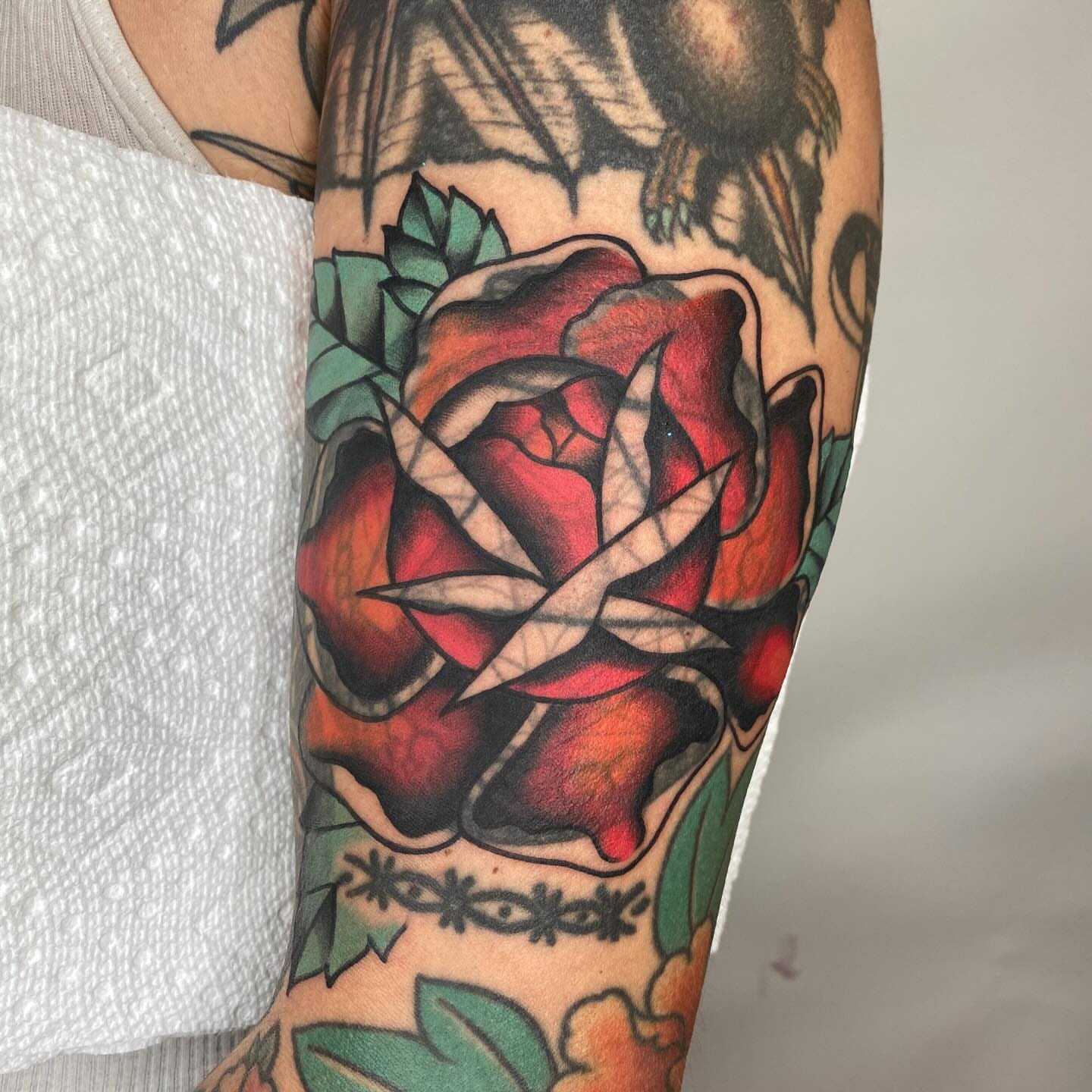 Red rose American traditional tattoo on the forearm by Vivian HavaTattoo, Richmond, Virginia