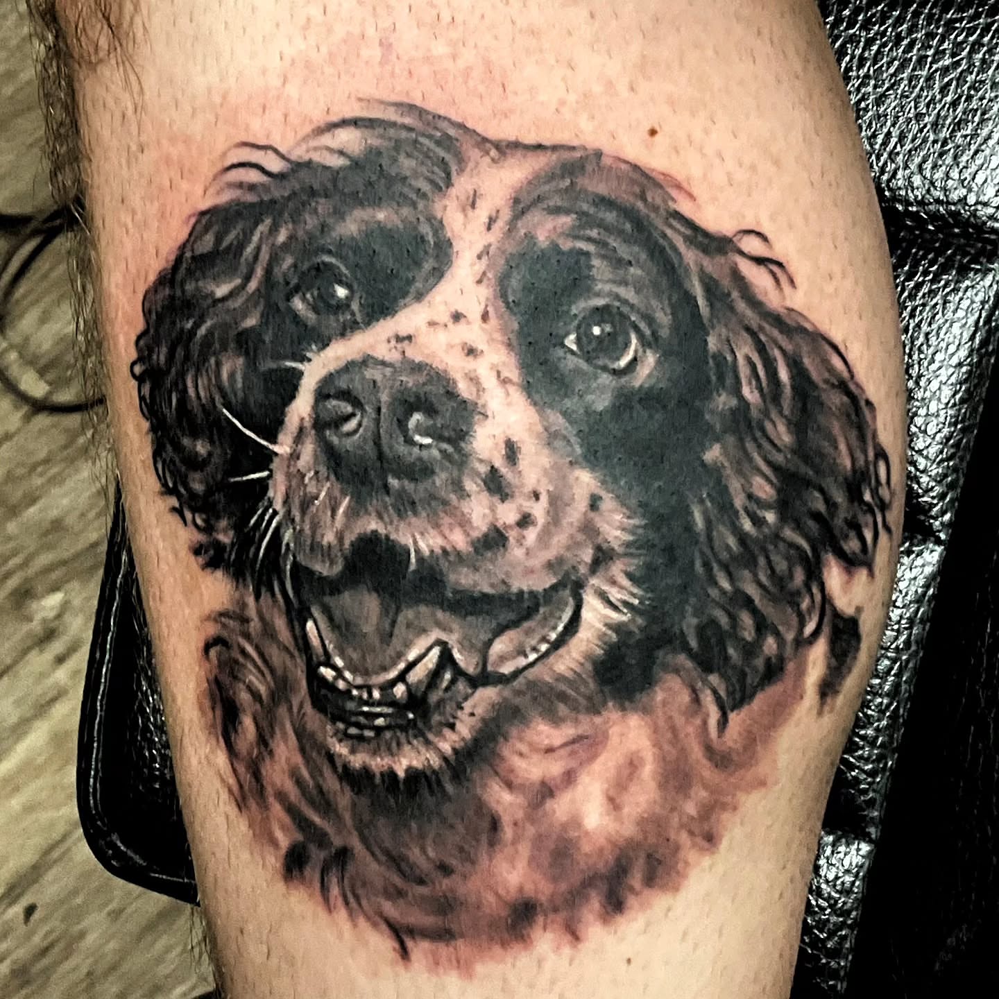 Dog realism tattoo on the forearm by Bruce Riehl