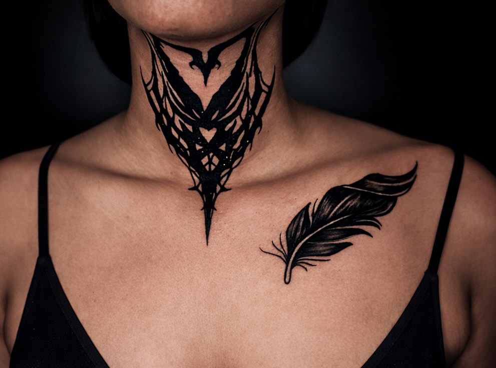 Feather black and grey tattoo on the chest by Shane Boss, Toronto, Ontario
