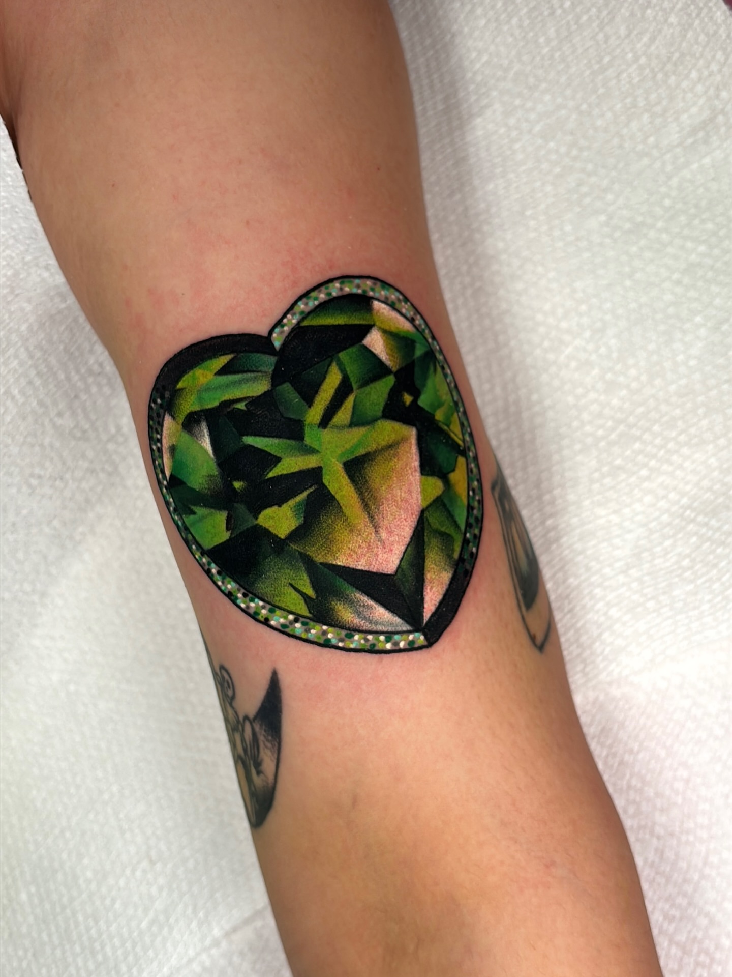 Geometric heart geometric tattoo on the forearm by Latesha Burnley