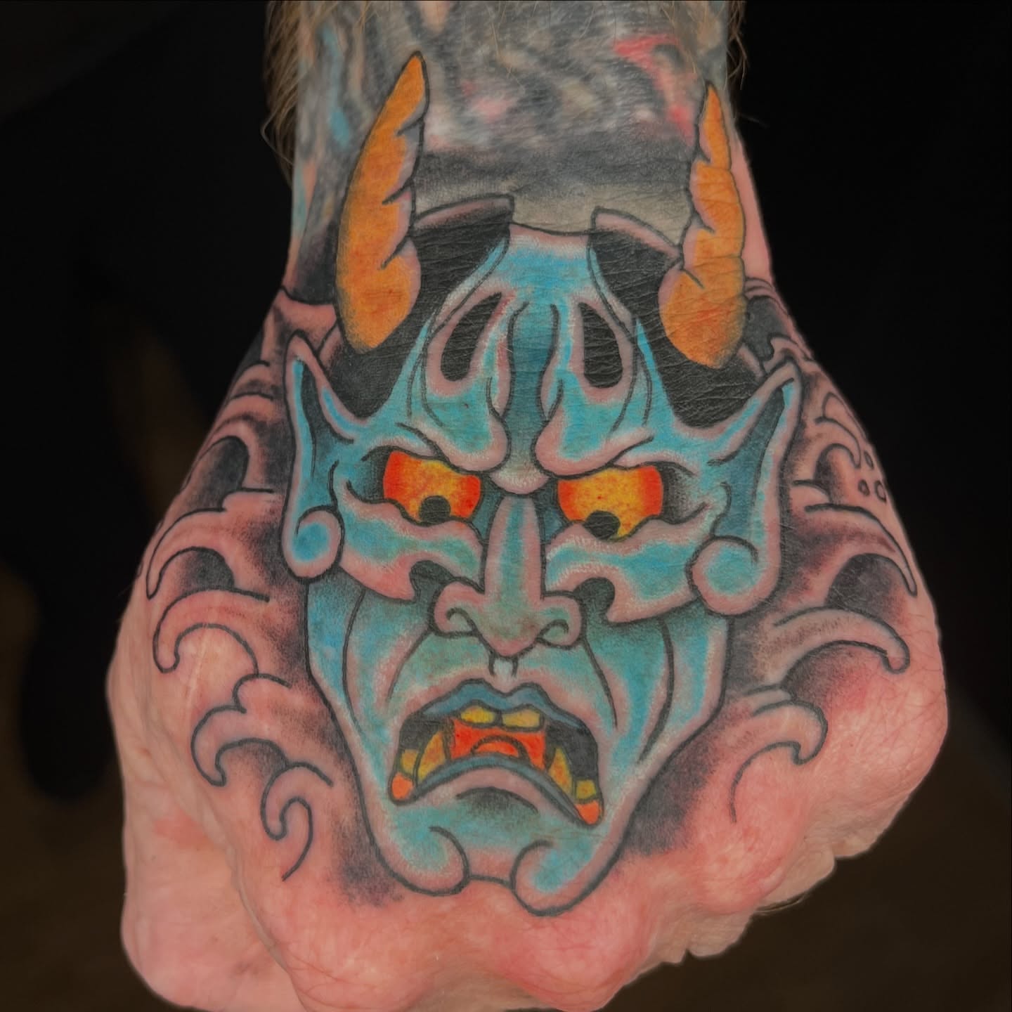 Demon mask American traditional tattoo on the forearm by Brian Easlon