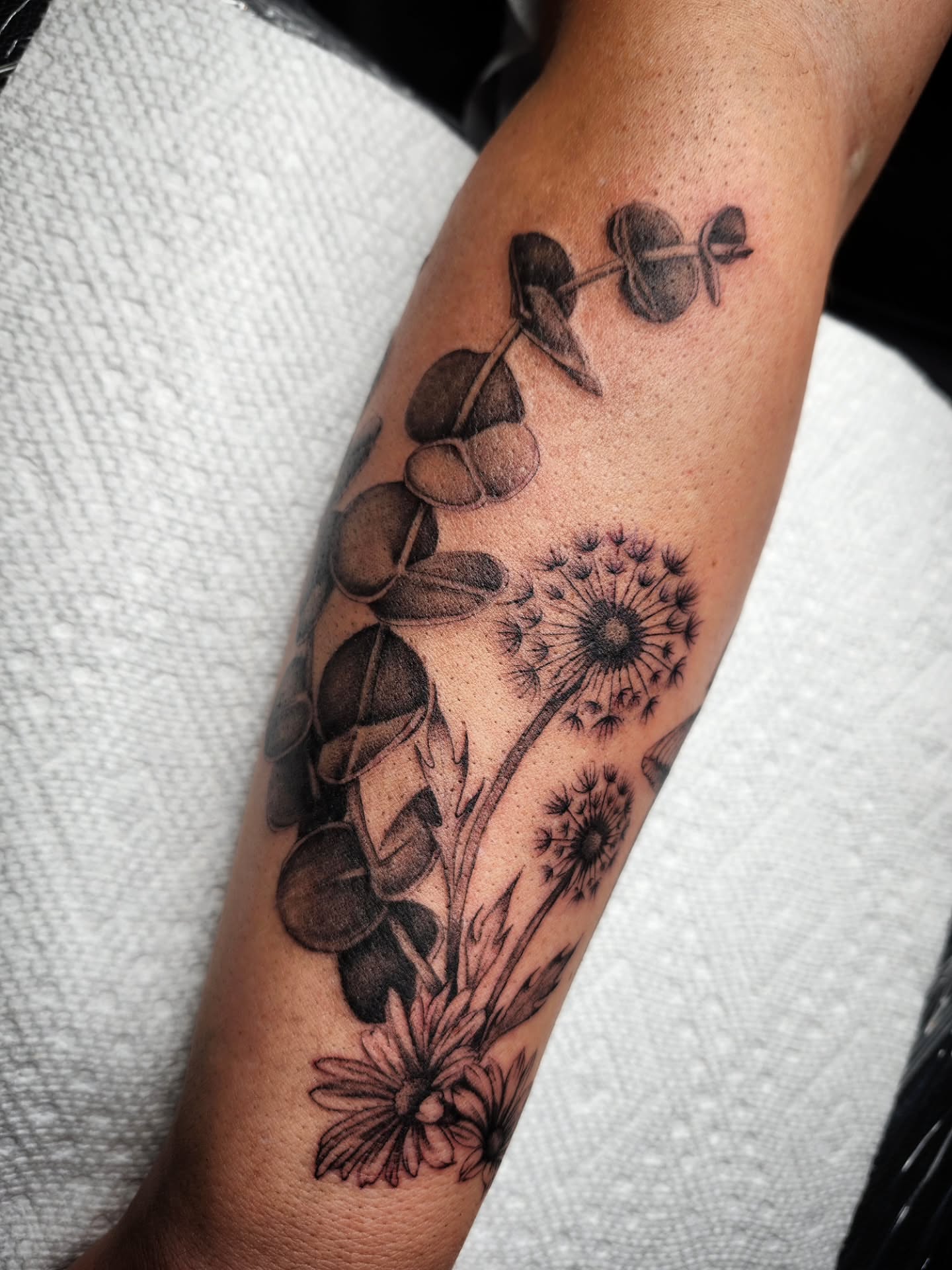 Botanical realism tattoo on the forearm by Kelly Zito