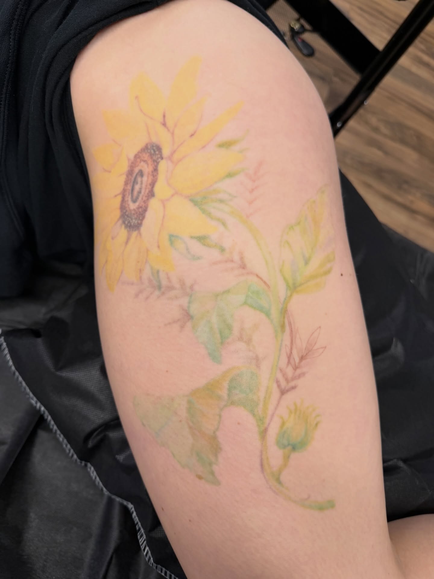 Sunflower watercolor tattoo on the forearm by πππππ βππ£π£ππ€ππ , Tucson, Arizona
