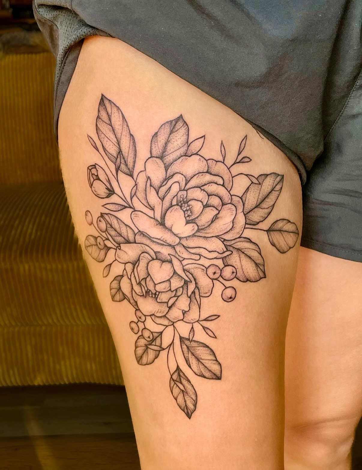 Floral bouquet realism tattoo on the thigh by Hannah, Portland, Oregon