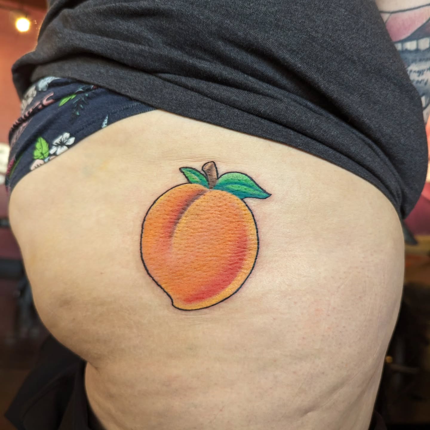Peach watercolor tattoo on the thigh by Jou Smile (Jo)