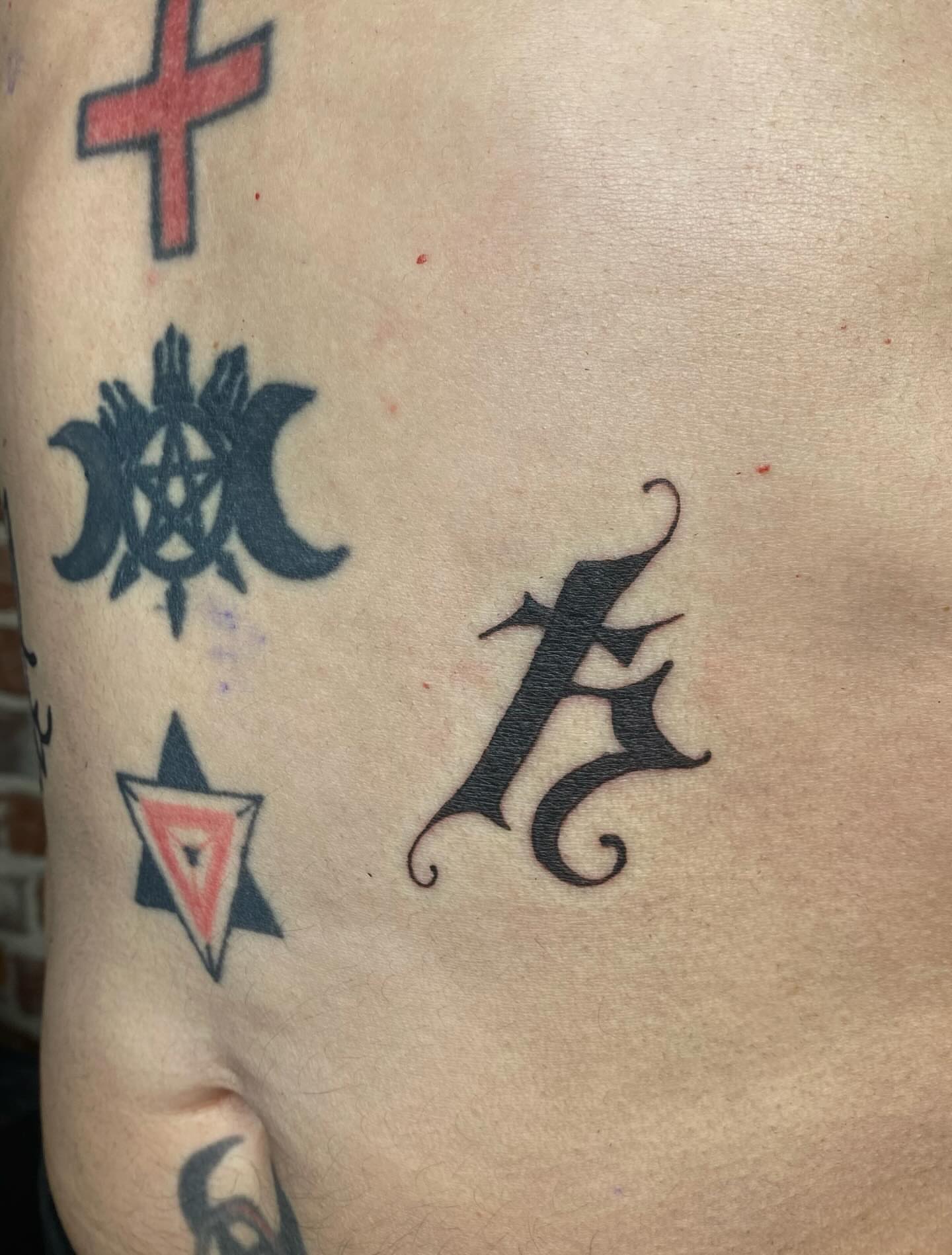 Letter A American traditional tattoo on the chest by sarah 🗝️