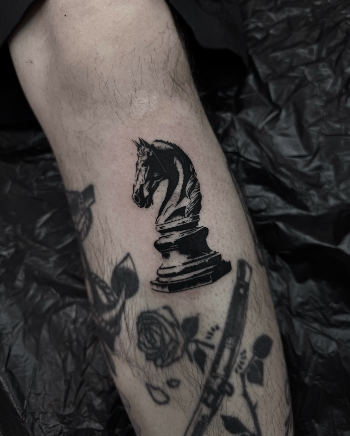 Chess knight black and grey tattoo on the forearm by Blackwork Vamos