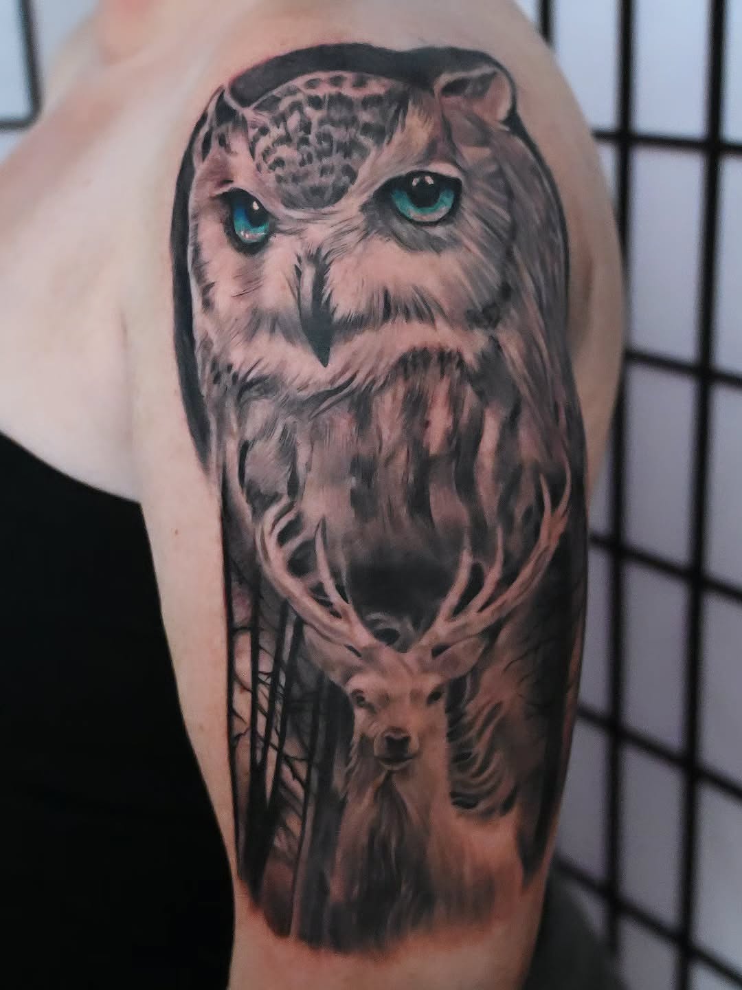 Owl and deer realism tattoo on the forearm by Michael ORegan