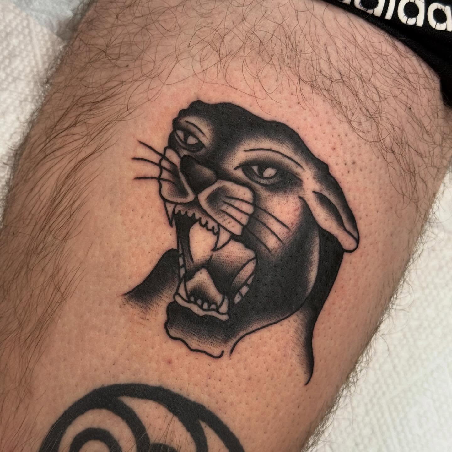 Angry otter black and grey tattoo on the thigh by Ben