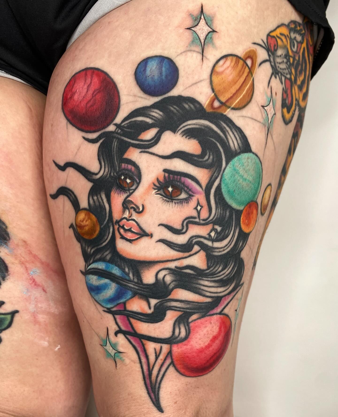 Space-themed portrait American traditional tattoo on the thigh by Vivian HavaTattoo, Richmond, Virginia