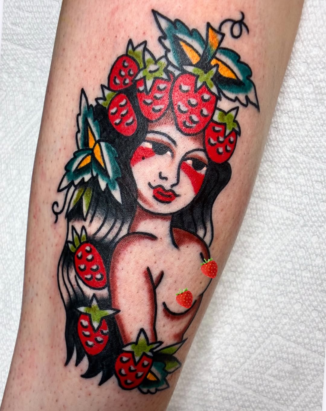 Woman with strawberries neo-traditional tattoo on the forearm by Sav Robinson
