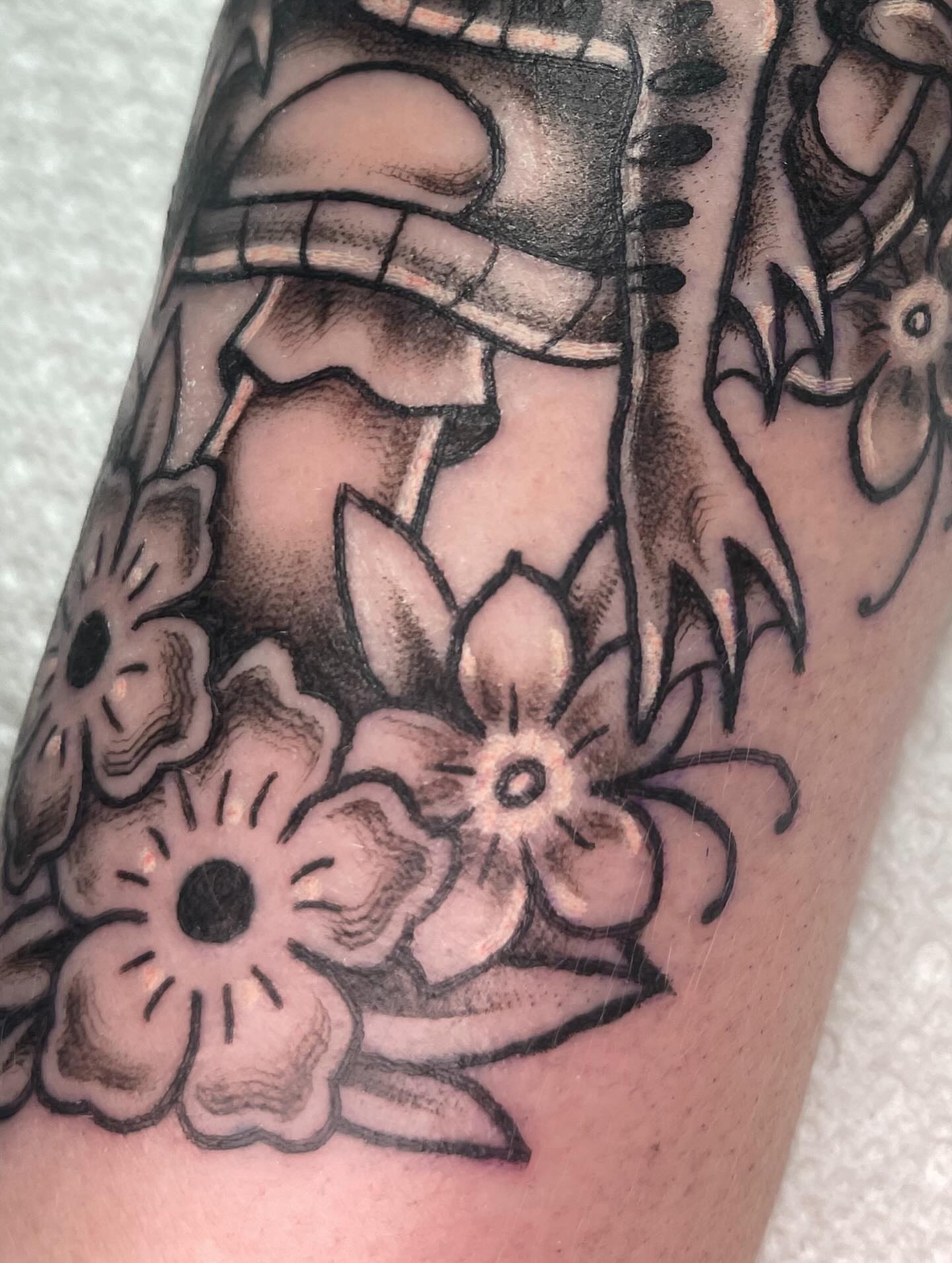 Lotus flowers and dragon black and grey tattoo on the forearm by Eric (EK) Kuldell