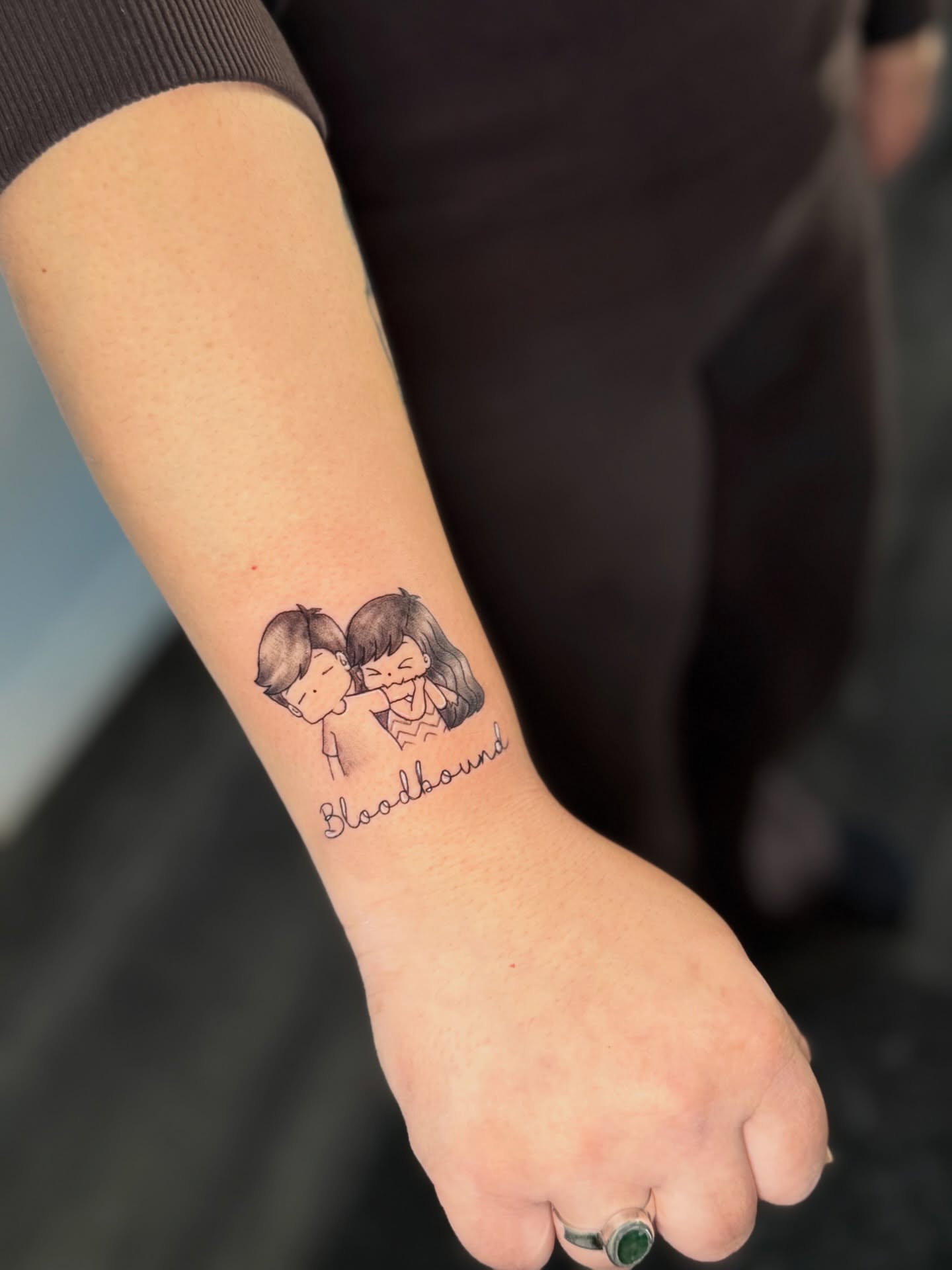 Bloodhound black and grey tattoo on the forearm by Mandy Kaur