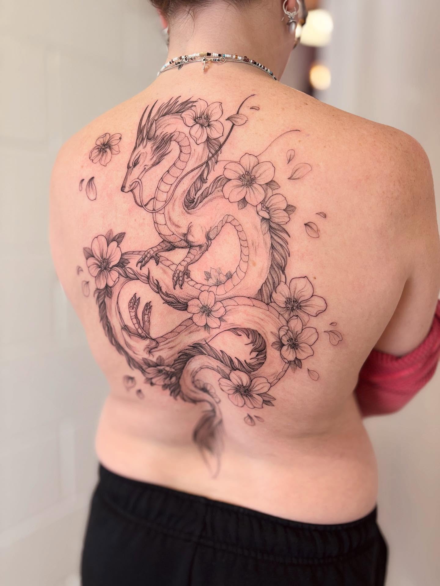 Dragon and flowers realism tattoo on the back by vaprol tattoo ✧ Boston