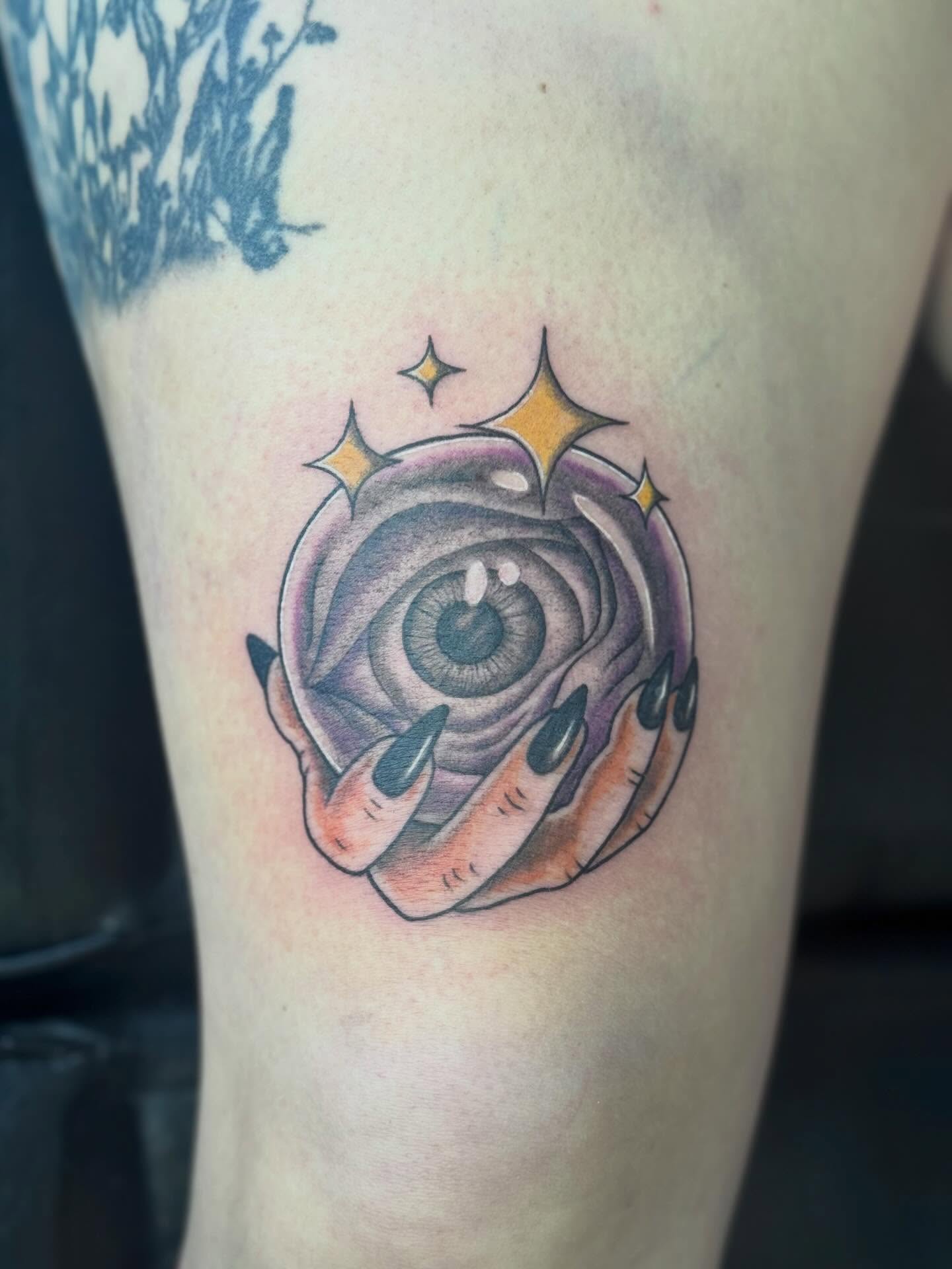 Eye within rose realism tattoo on the forearm by @carissaetattoos
