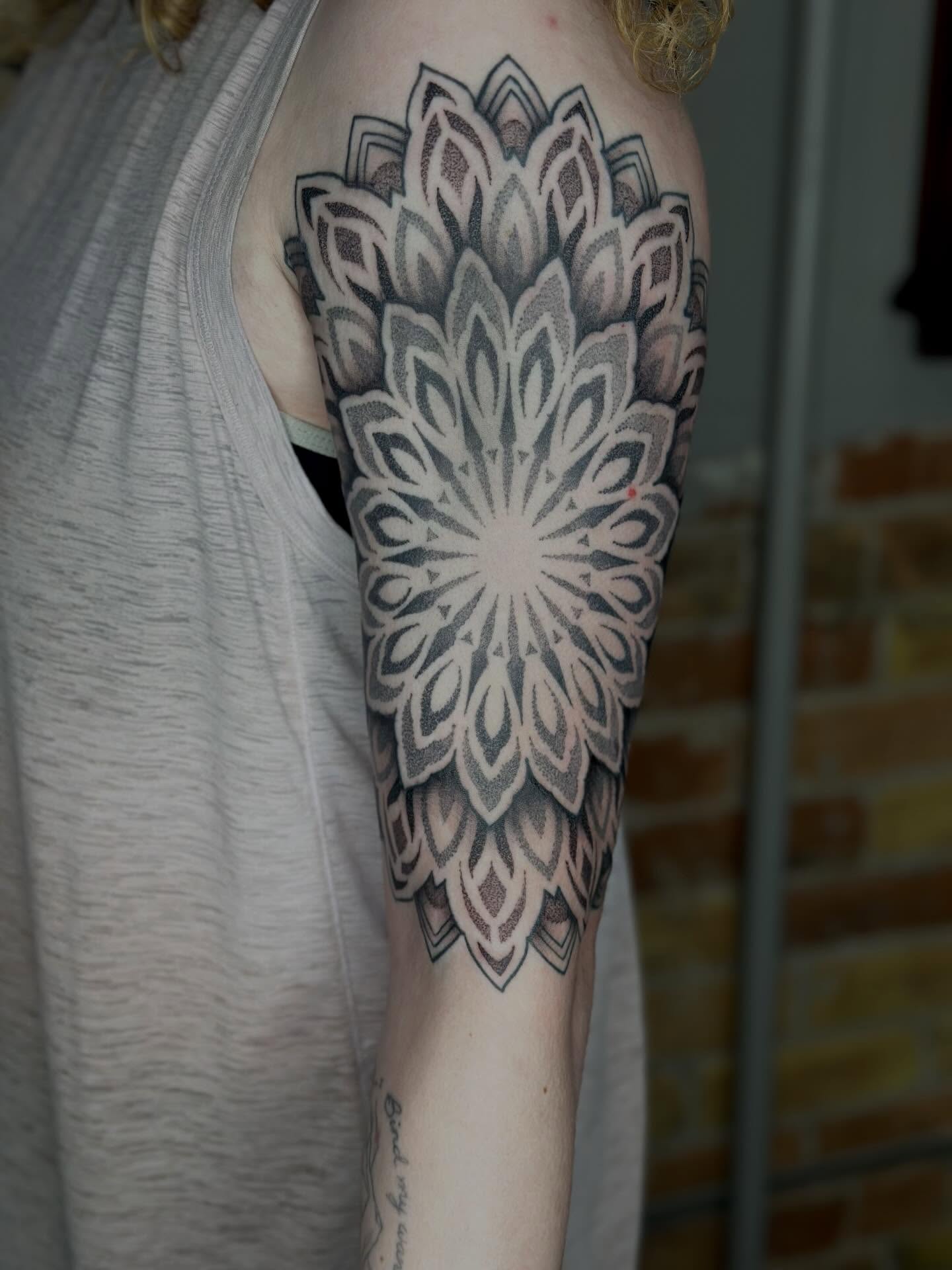 Geometric mandala geometric tattoo on the forearm by Kat Fishbein