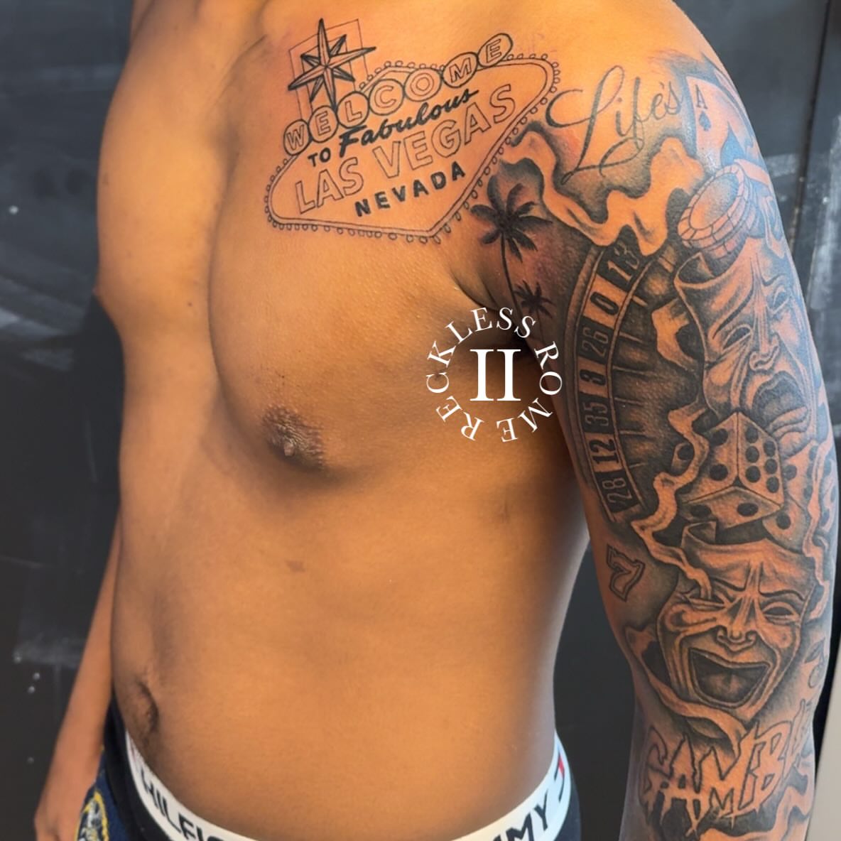 Las vegas sign American traditional tattoo on the chest by Rome