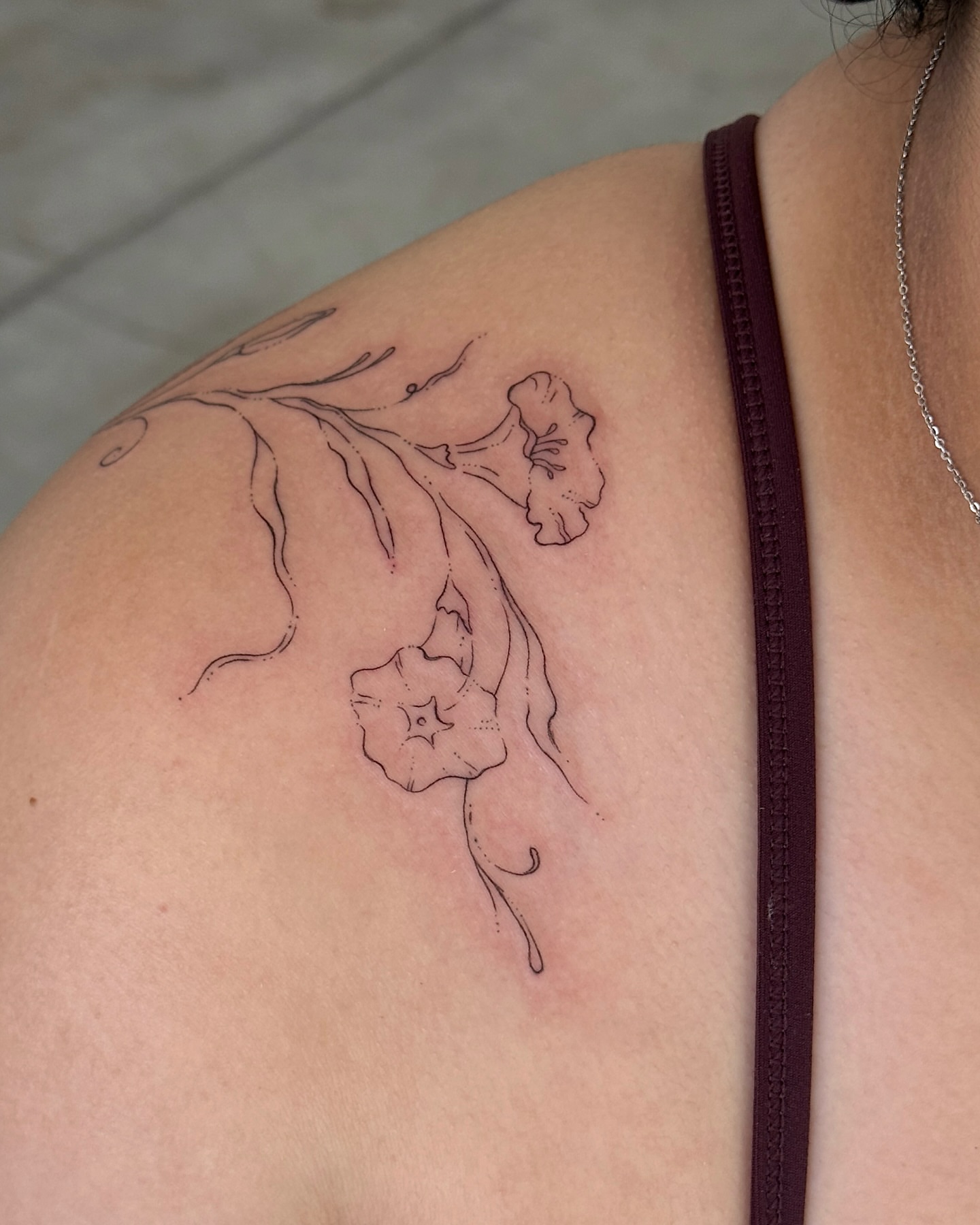 Flowers fine line tattoo on the shoulder by Inky Apricot, Austin, Texas
