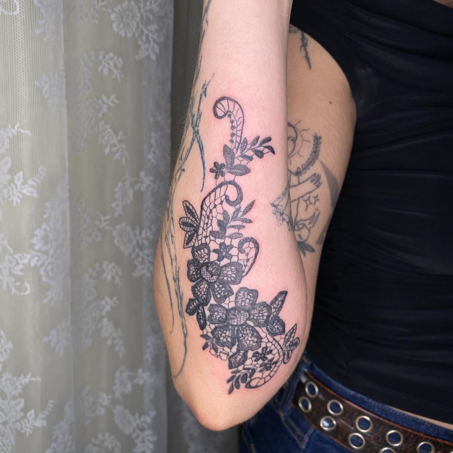 Lace floral design black and grey tattoo on the forearm by °₊⊹ delia ✩ jane ೃ࿔*