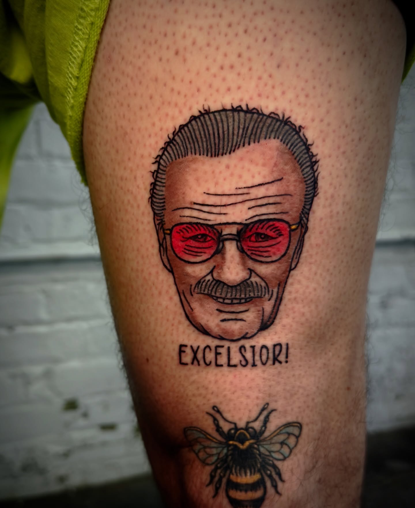 Stanley lee realism tattoo on the thigh by Jeff Brock