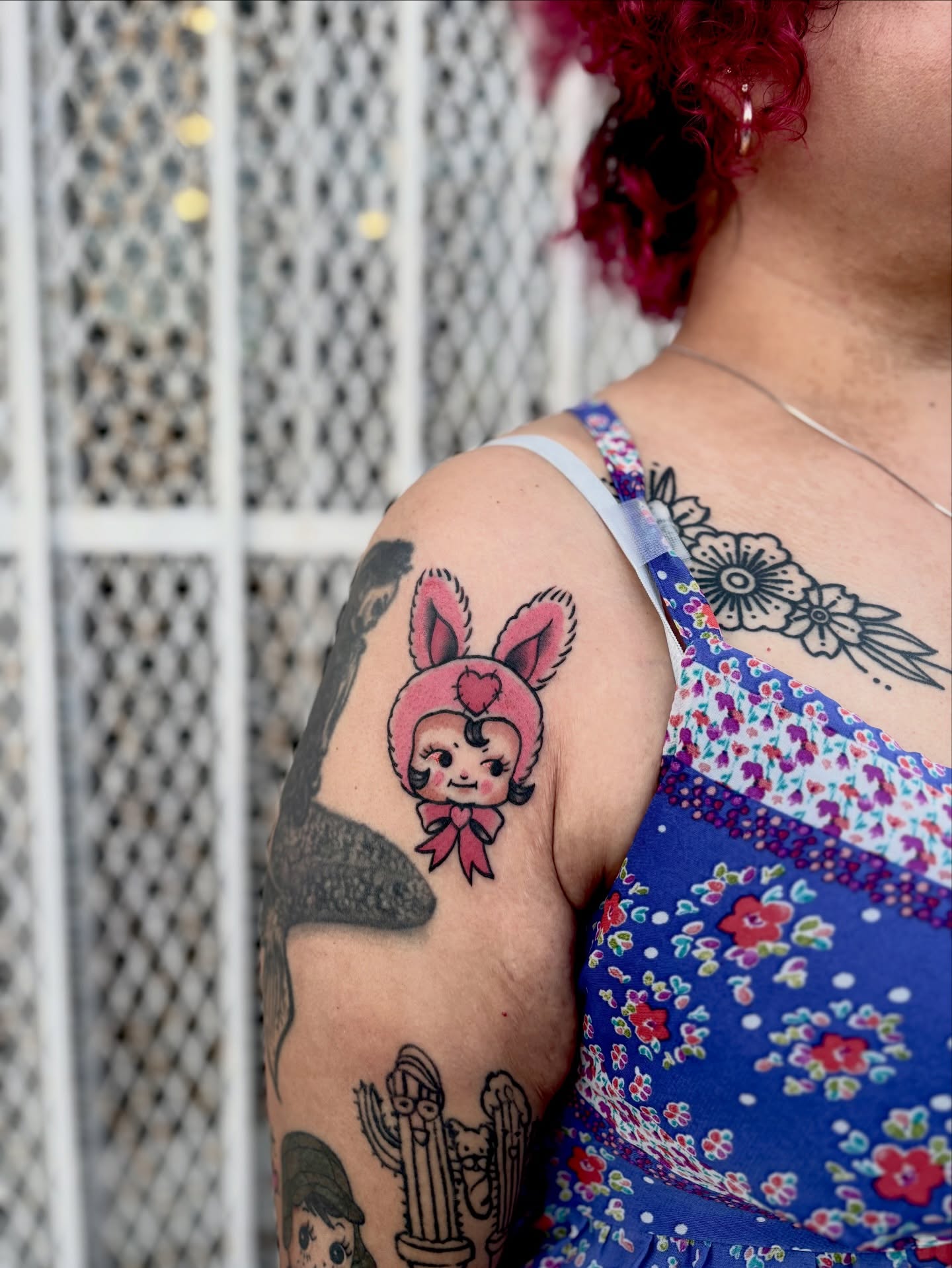 Bunny girl American traditional tattoo on the upper arm by Barbara Gonzalez