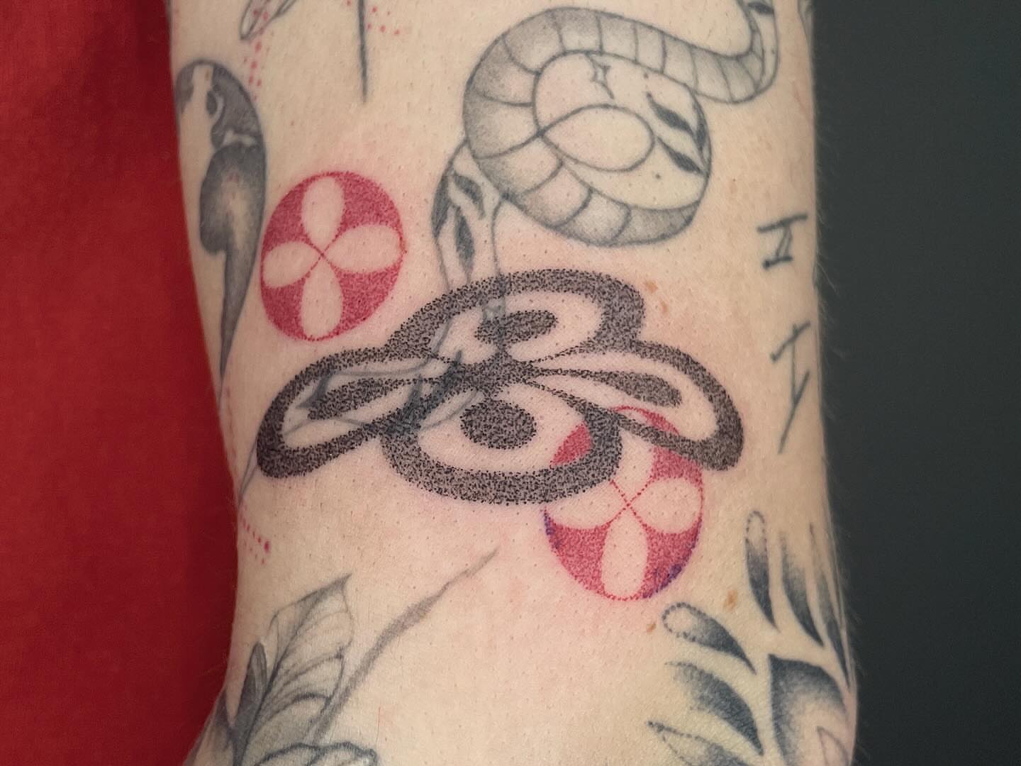 Snake and flower dotwork tattoo on the forearm by Thiên Hồ