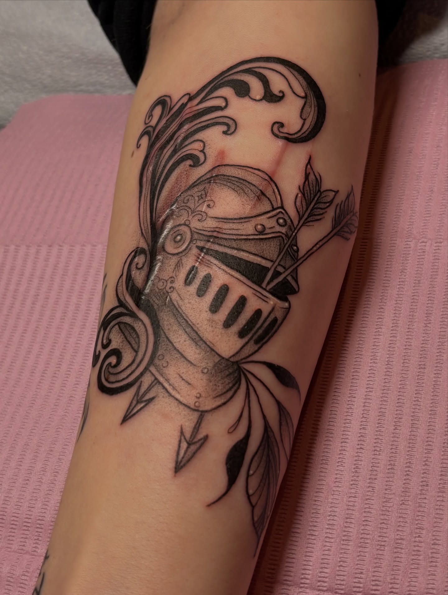 Helmet and arrow black and grey tattoo on the forearm by Jen Osborne ♡ Cincinnati Tattoo Artist