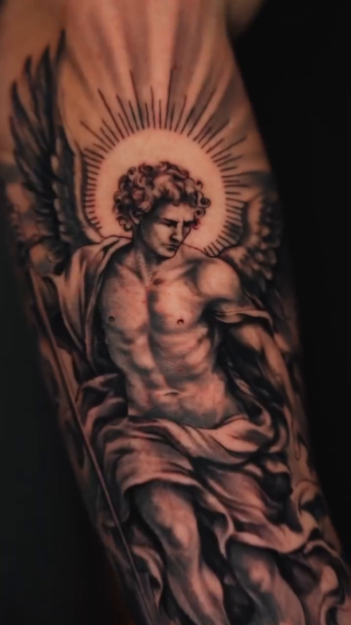 Angel realism tattoo by Andres García Baeza