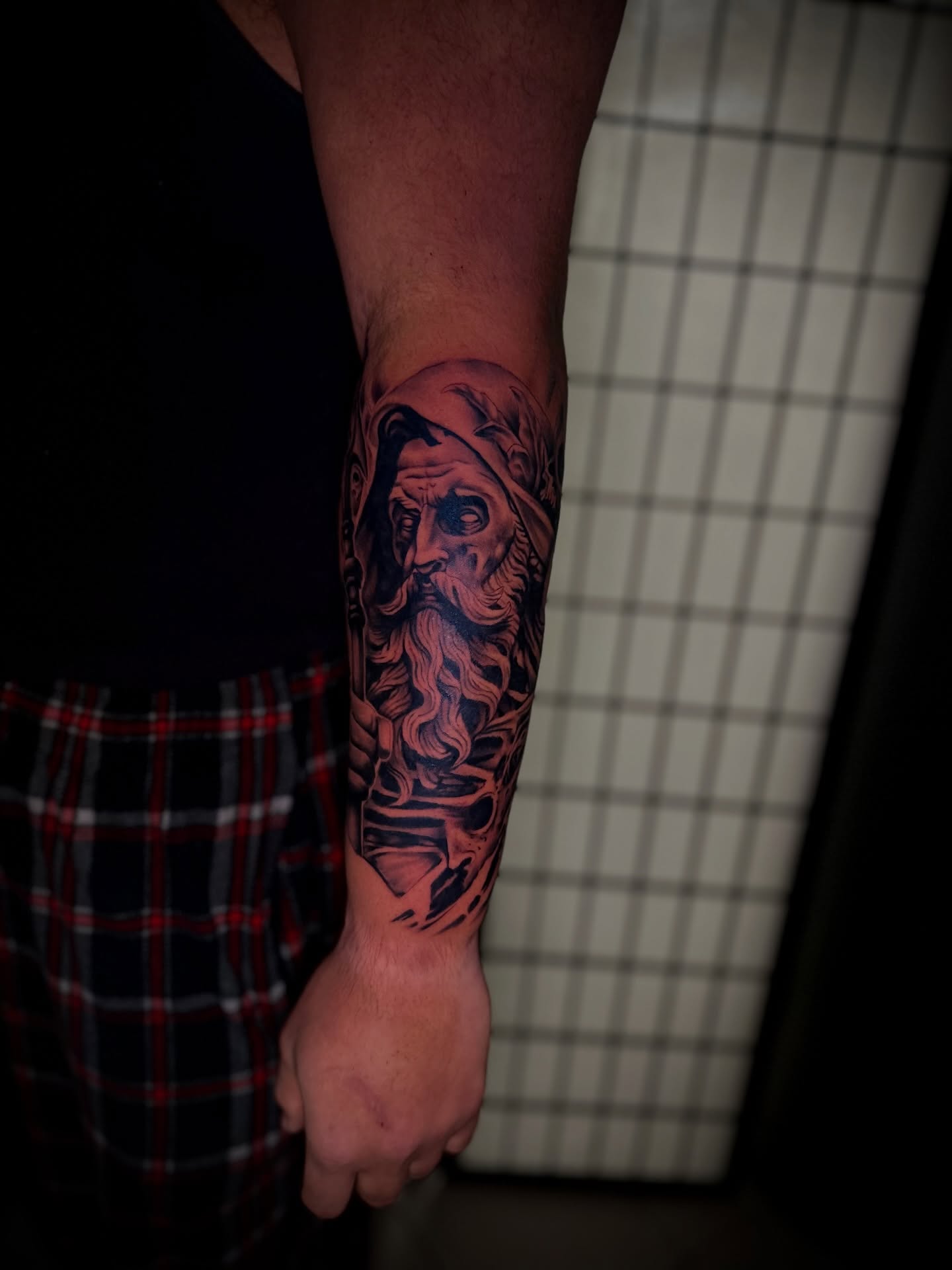 Bearded man realism tattoo on the forearm by Robert Douglas