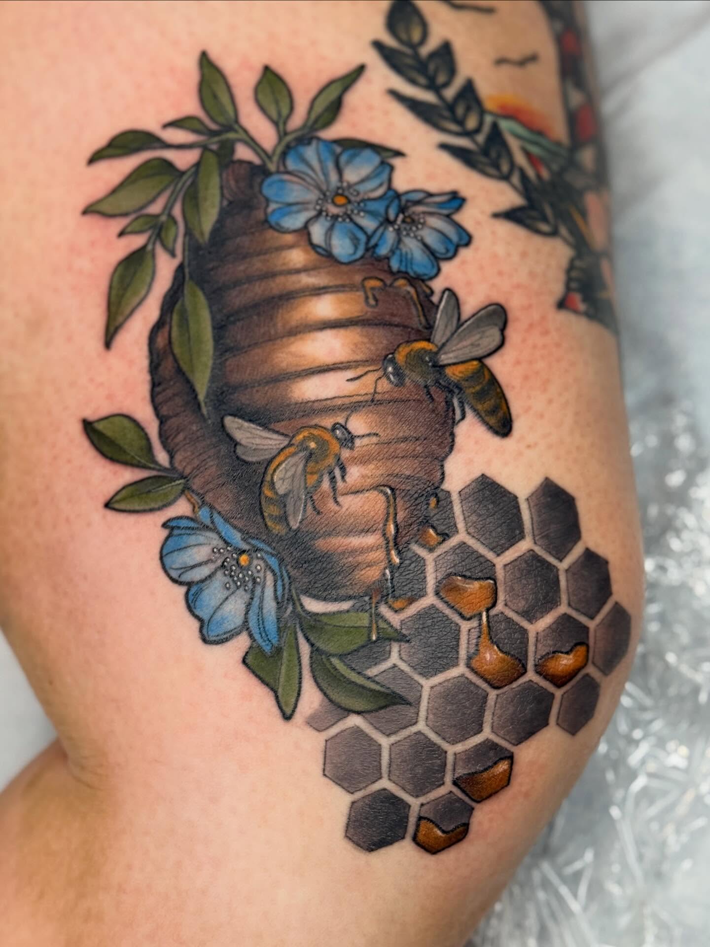 Bees and hive American traditional tattoo on the thigh by Rachael Shelly