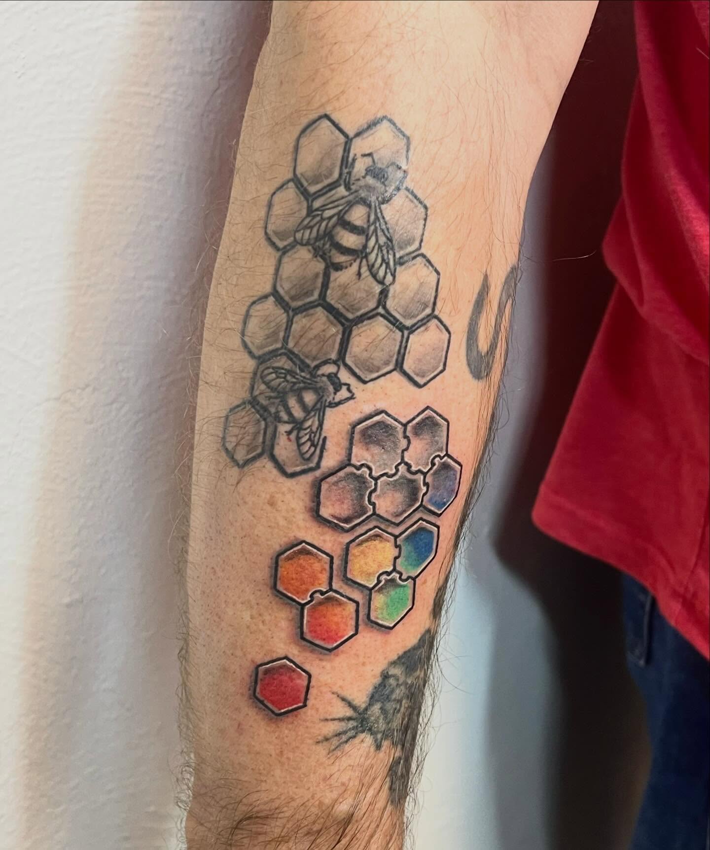 Bees and hexagons geometric tattoo on the forearm by Amber Rose