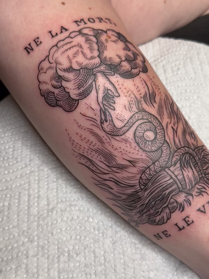 Cloud and snake black and grey tattoo on the forearm by Summer Shield