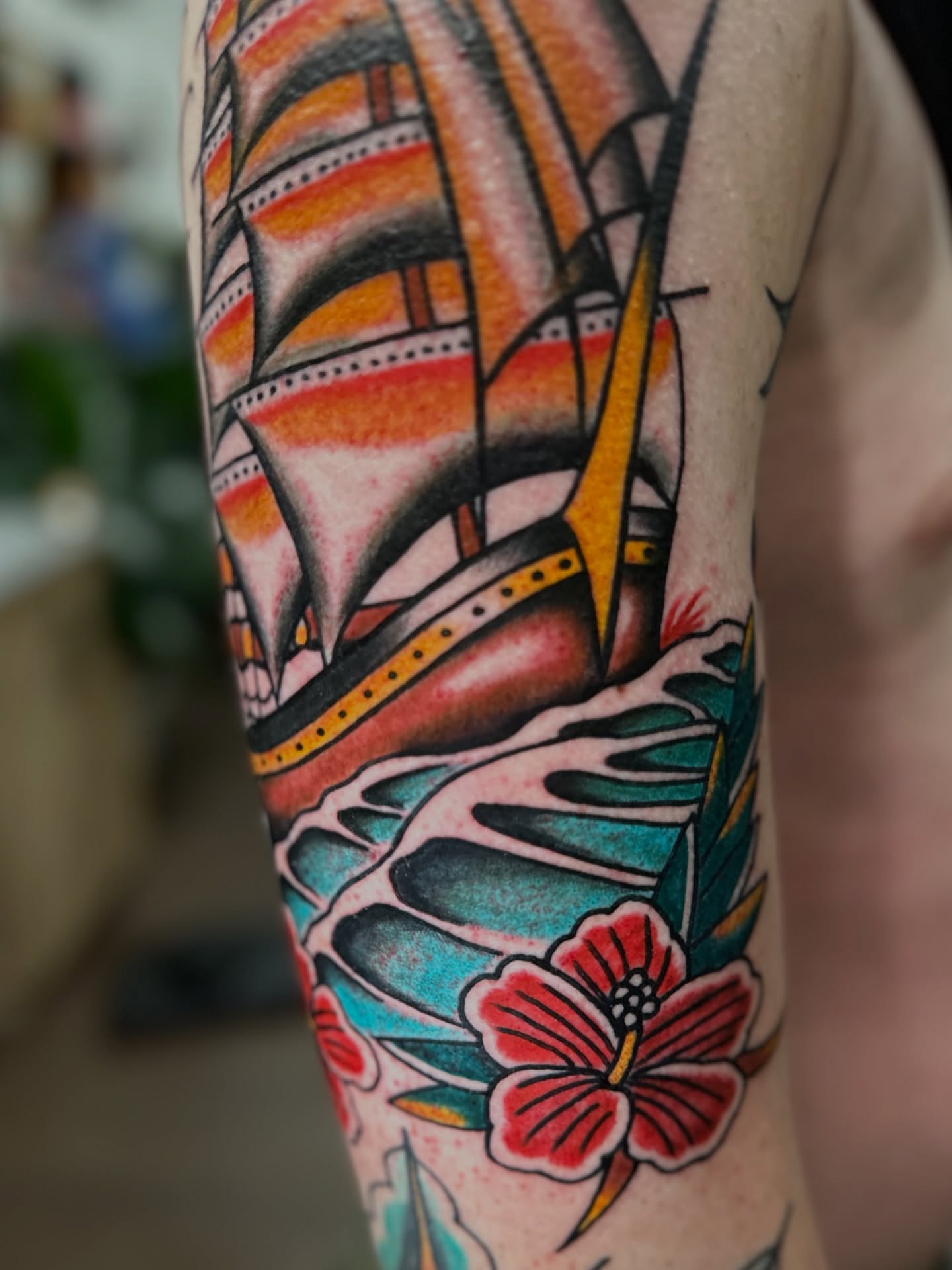 Ship and hibiscus American traditional tattoo on the forearm by Nick Weaver aka gibby sometimes gilbert
