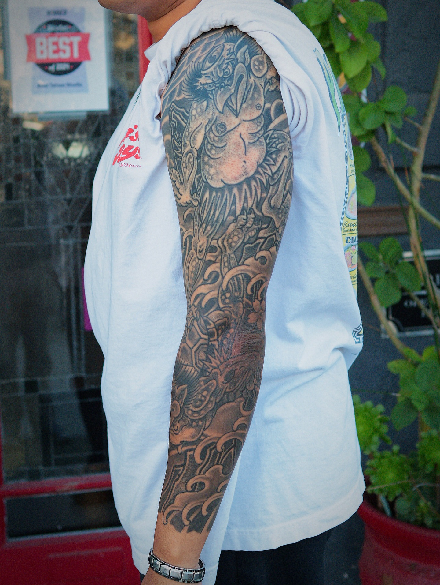 Dragon and waves japanese irezumi tattoo on the upper arm by Chris Cockrill