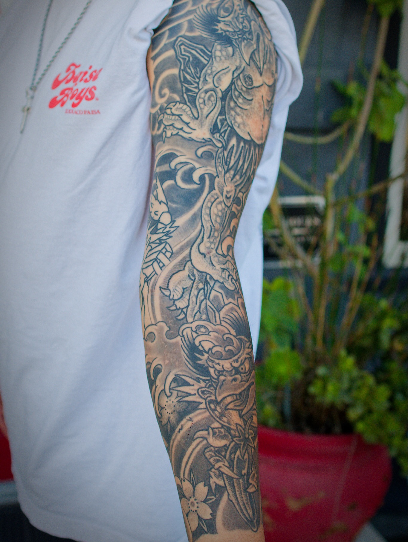 Dragon and waves japanese irezumi tattoo on the forearm by Chris Cockrill