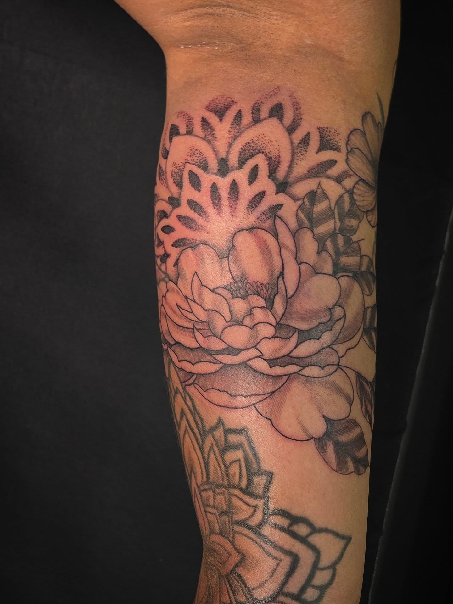 Peony black and grey tattoo on the forearm by Linda Marroum, Morningside, Maryland