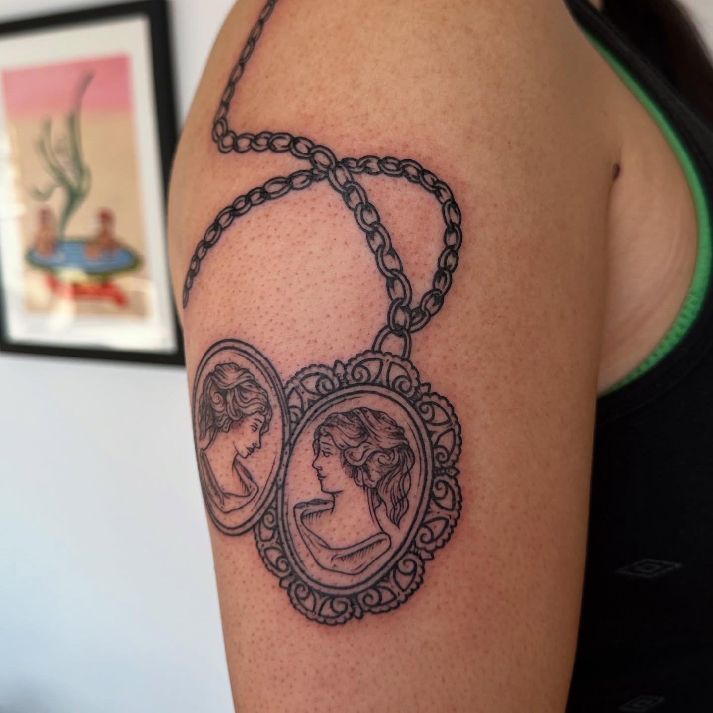 Cameo portraits black and grey tattoo on the shoulder by rosalie