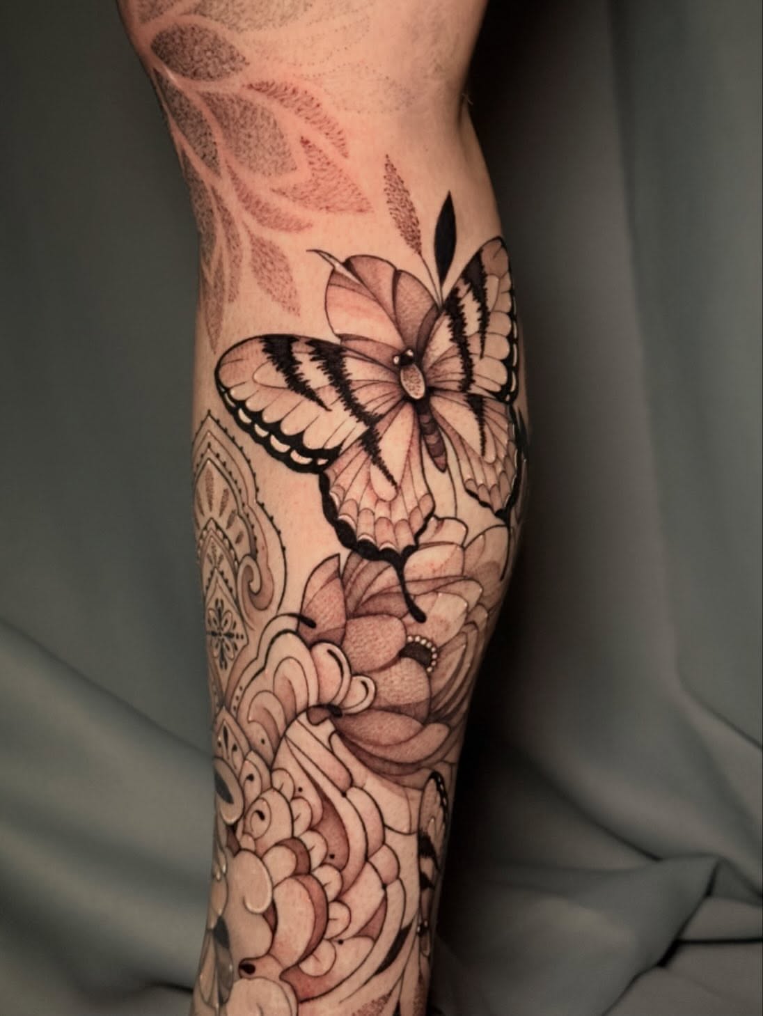 Butterfly and floral dotwork tattoo on the forearm by Andreanna Rosemarie Gabranidis, Pennsauken, New Jersey