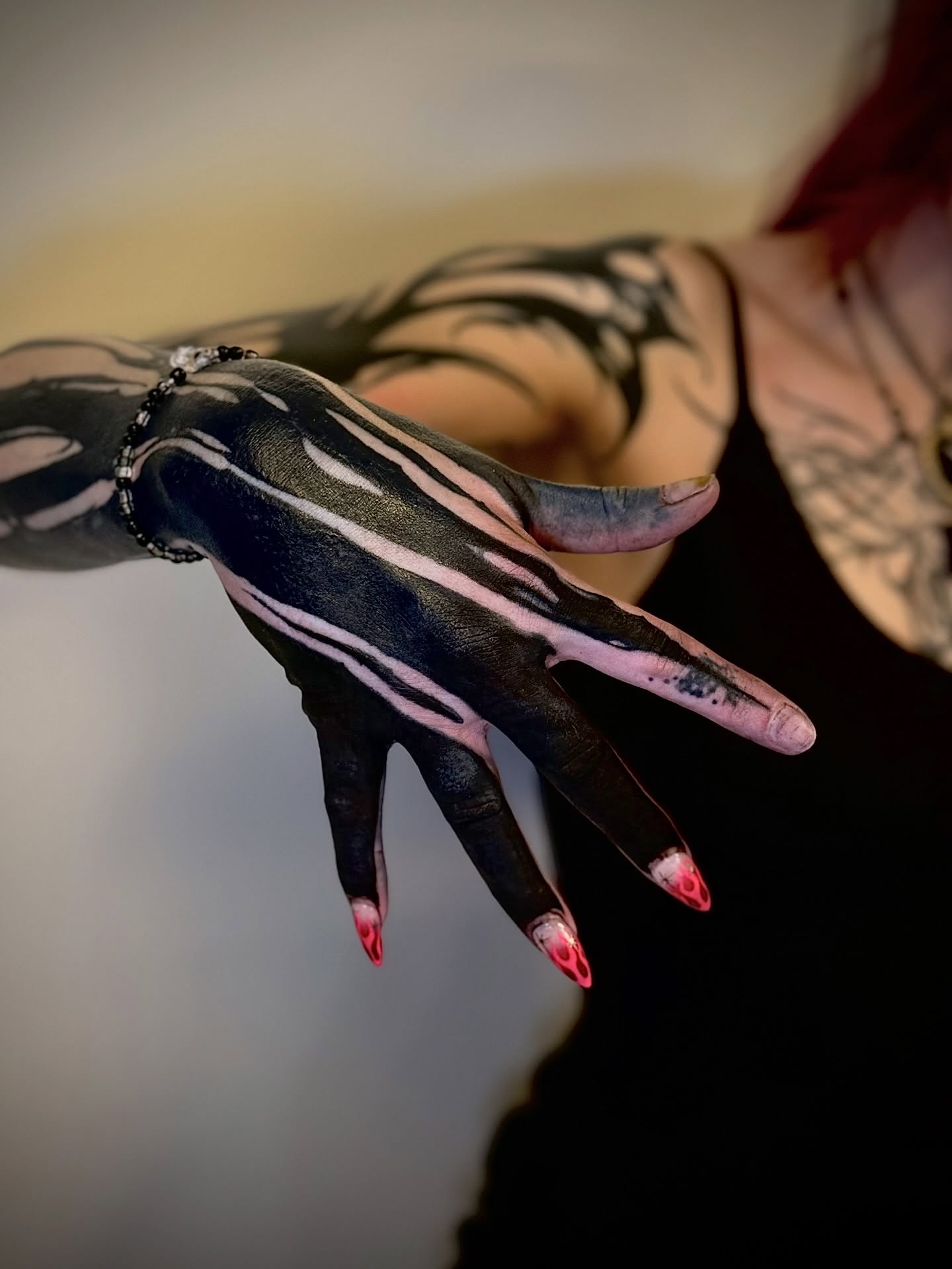 Abstract pattern black and grey tattoo on the hand by Thomas Martinez