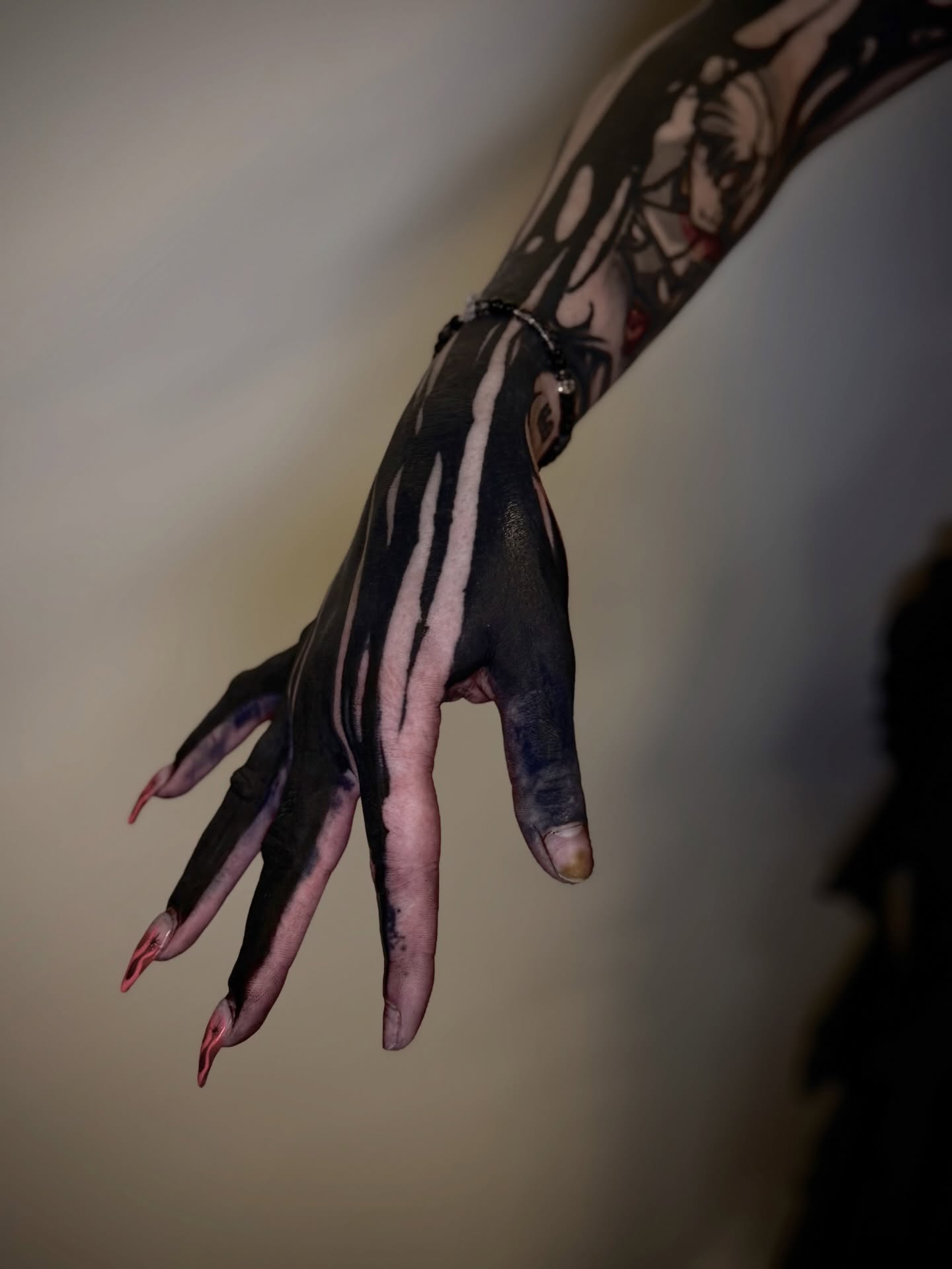 Striped hand black and grey tattoo on the hand by Thomas Martinez