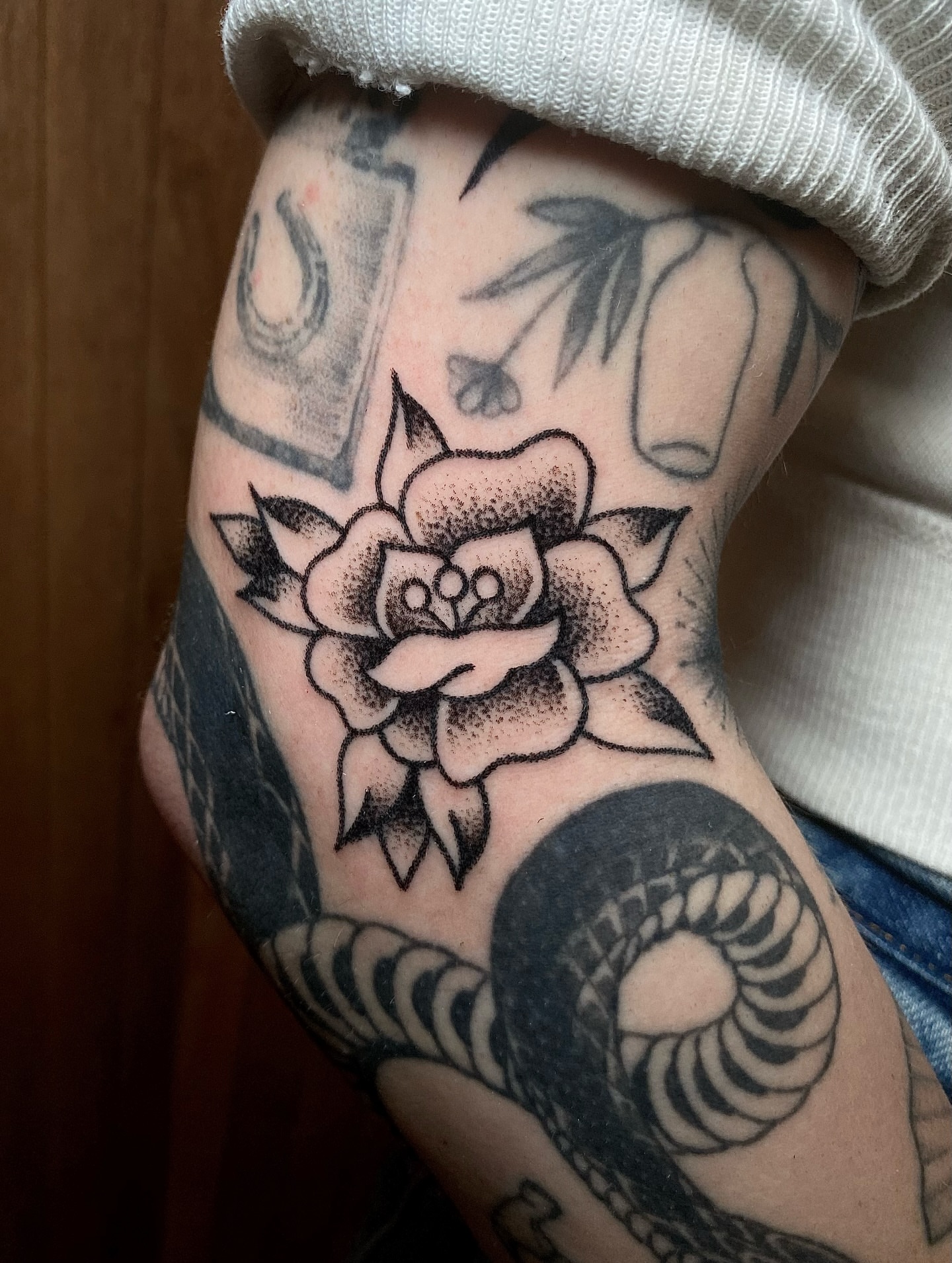 Flower dotwork tattoo on the forearm by Daniel Diego