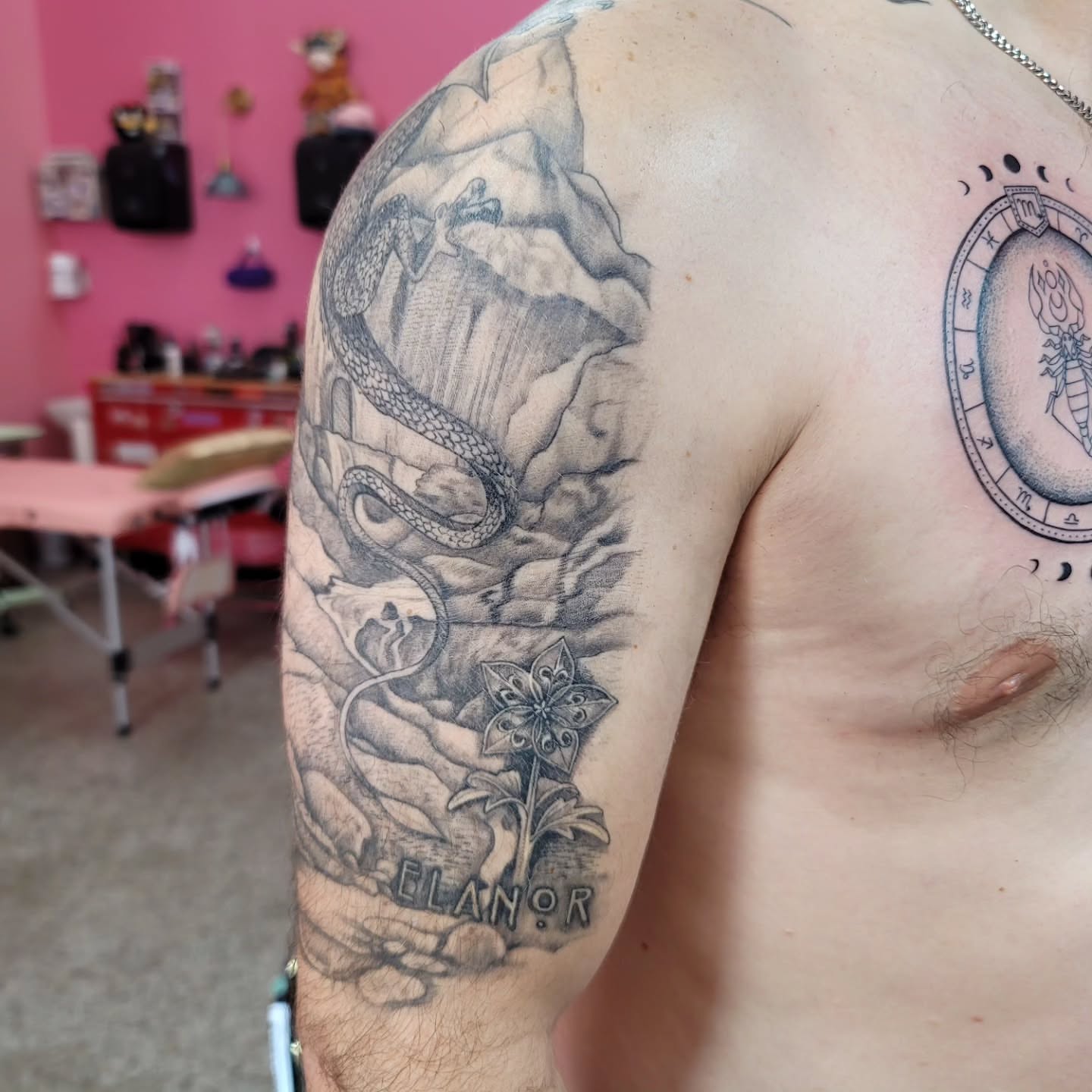 Snake and mountain realism tattoo on the shoulder by Mary Lefeau