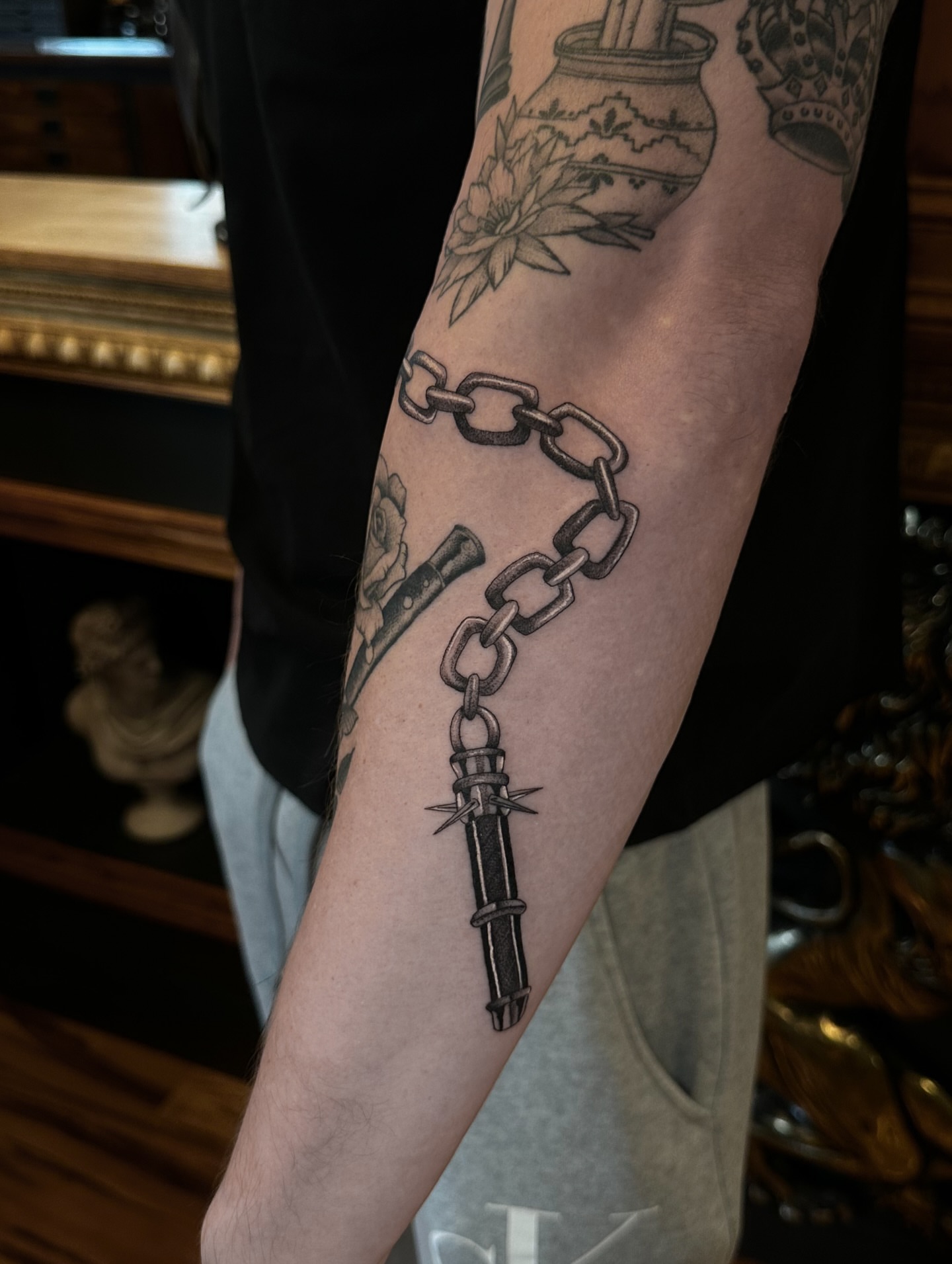 Chain and dagger black and grey tattoo on the forearm by Leo Fernandes, Danvers, Massachusetts